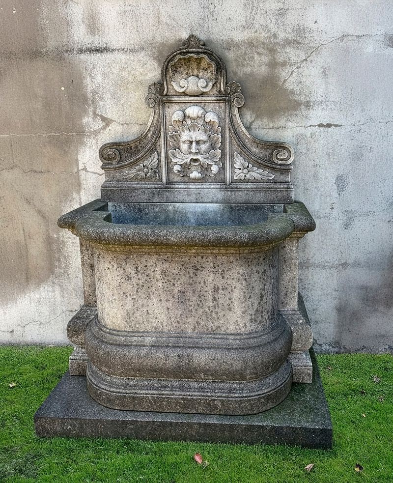 A CONTINENTAL SCULPTED LIMESTONE WALLFOUNTAIN, 20TH CENTURY (1 of 1)