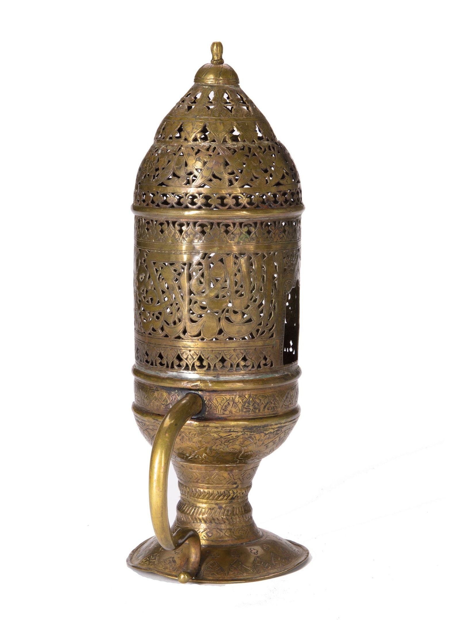 AN OTTOMAN BRASS INCENSE BURNER, 17TH-18TH CENTURY: With hinged openwork lid and curved, faceted handle, the lid with a central register of trefoil palmettes, smaller trefoils and arabesques above and below. The central part elegantly pierced with Arab