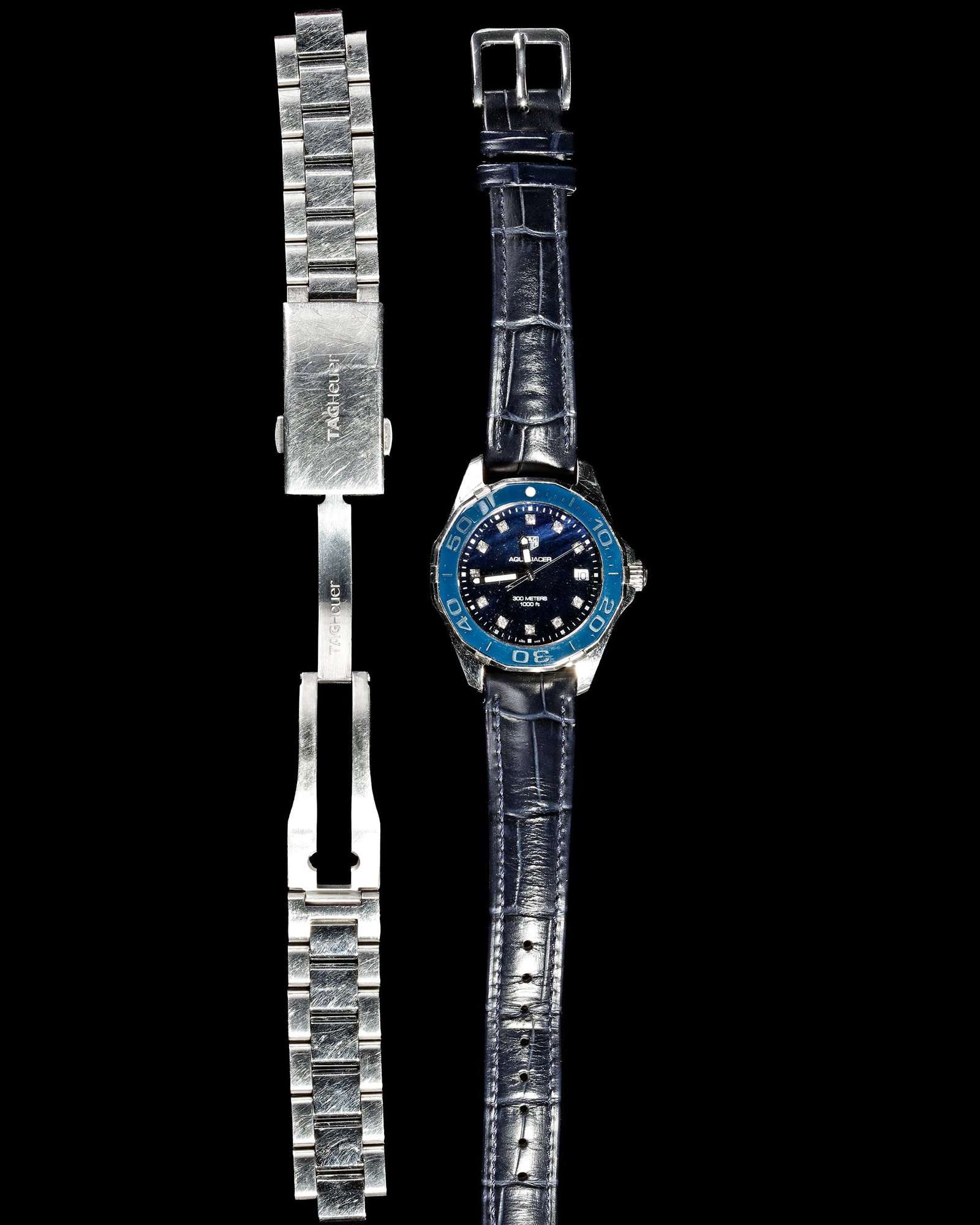 A TAGHEUER 'AQUA RACER' LADIES WATCH: With Tagheuer papers.