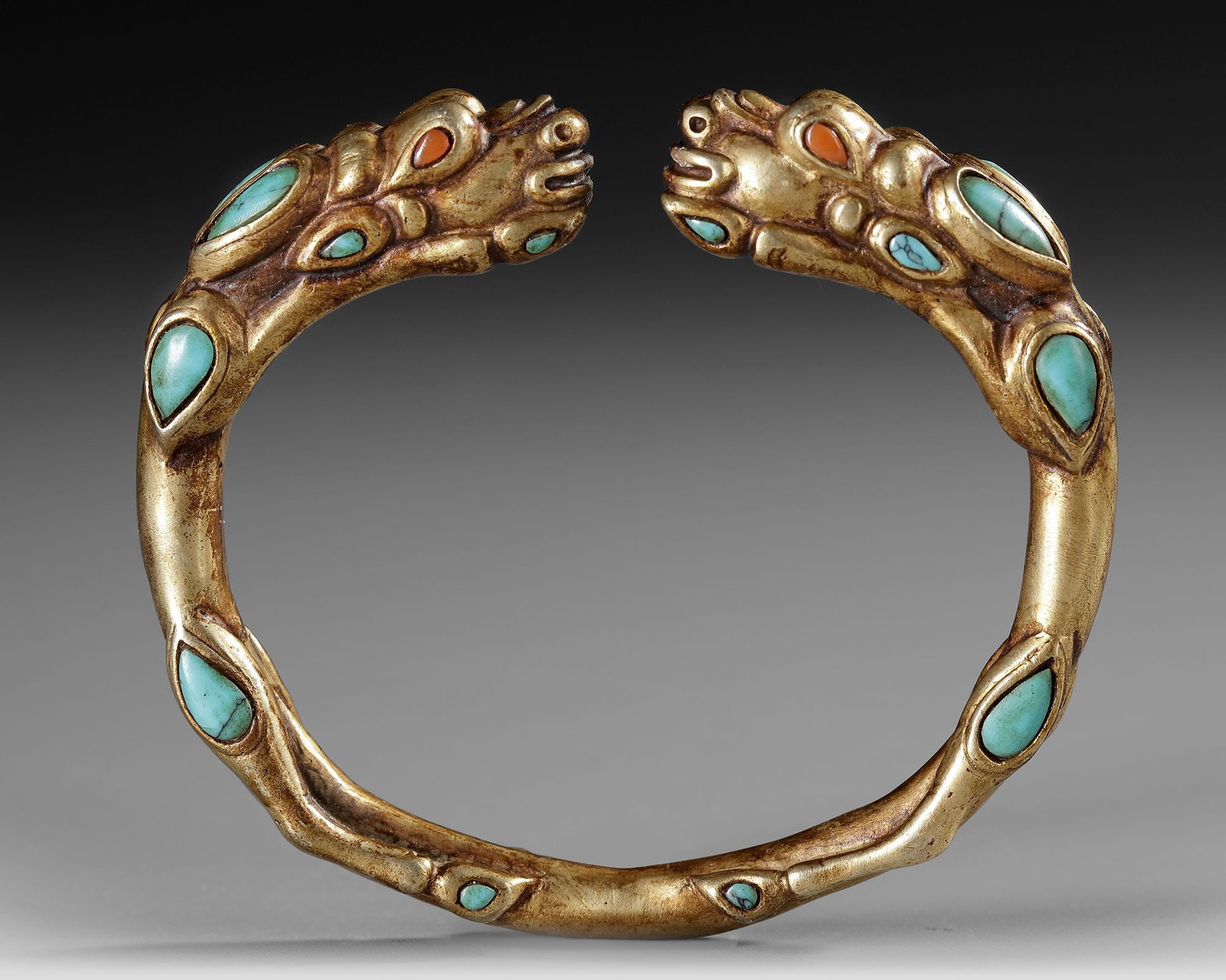 A SINO TIBETAN GILDED BANGLE (1 of 3)