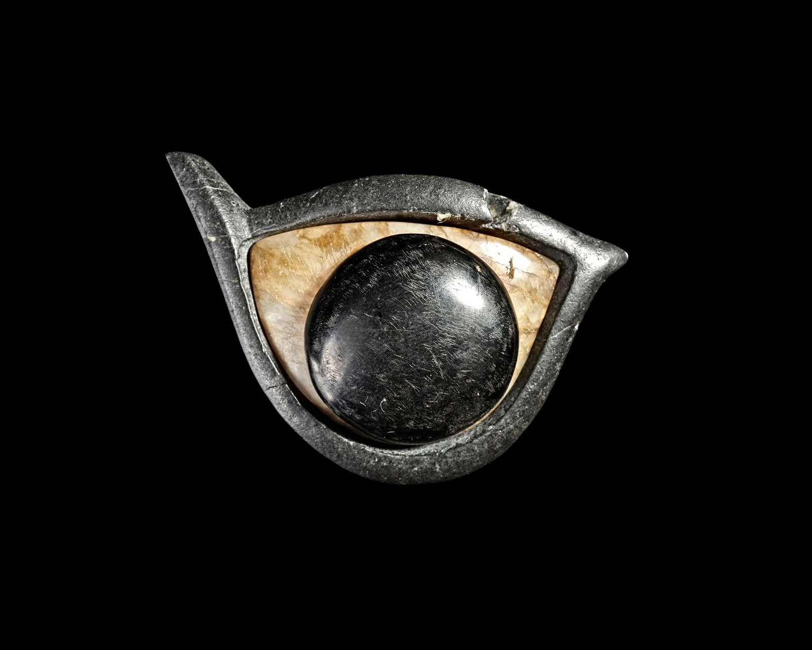 AN ANCIENT CARVED STEATITE EYE OF SEPARATE PARTS, 2000 BC (1 of 2)