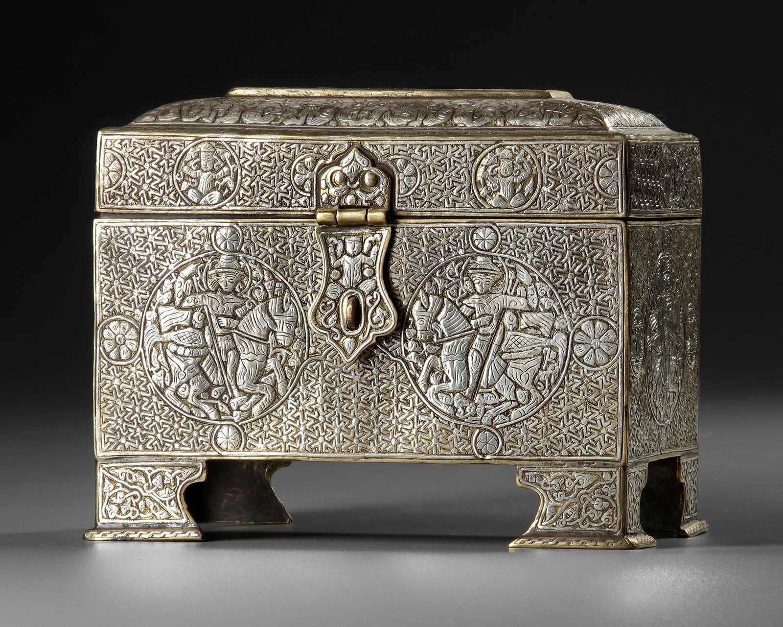A SILVER-INLAID CAST BRASS CASKET, KHURASAN-STYLE, 20TH CENTURY (1 of 3)
