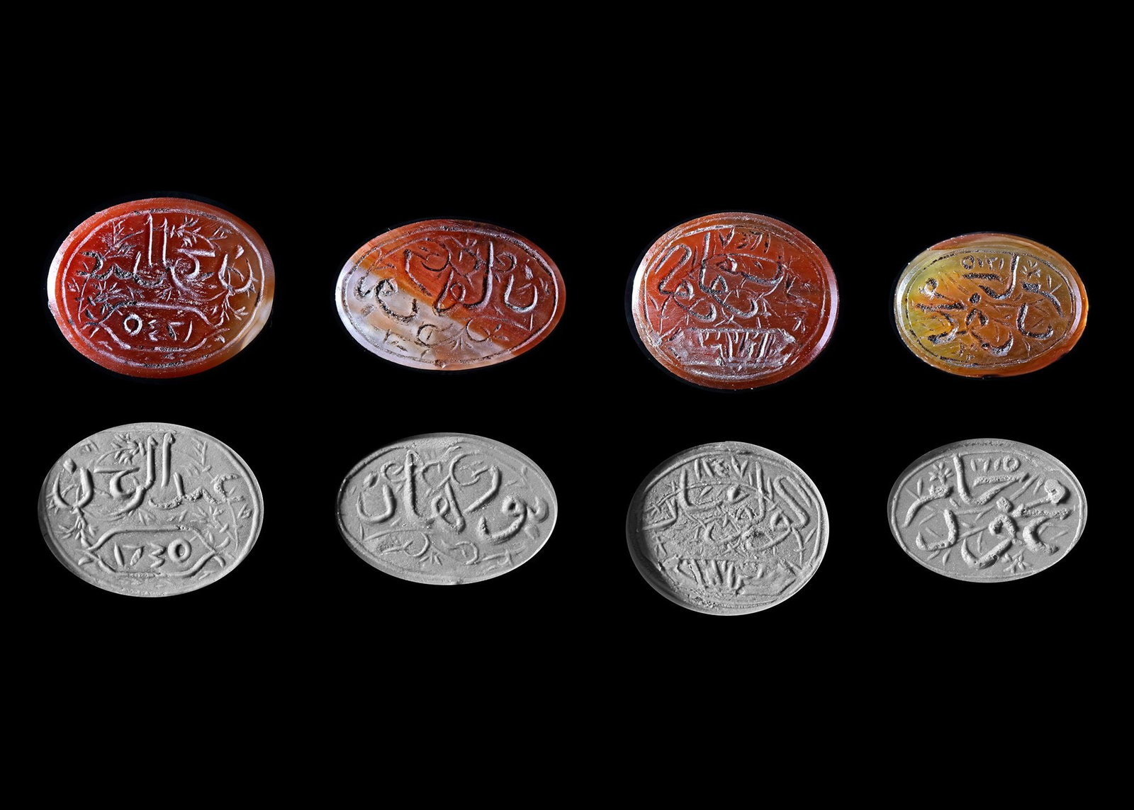 FOUR AGATE SEALS, PERSIA QAJAR, EARLY 19TH CENTURY: An agate seal with oval shape, engraved with the text "?…?­?…???? ?¨?† ?¬?§?¨?±, Mahmod bin jaber" in thuluth script and dated 1225 AH/1810 AD, 8 by 12 mm. An agate seal with oval shape, e