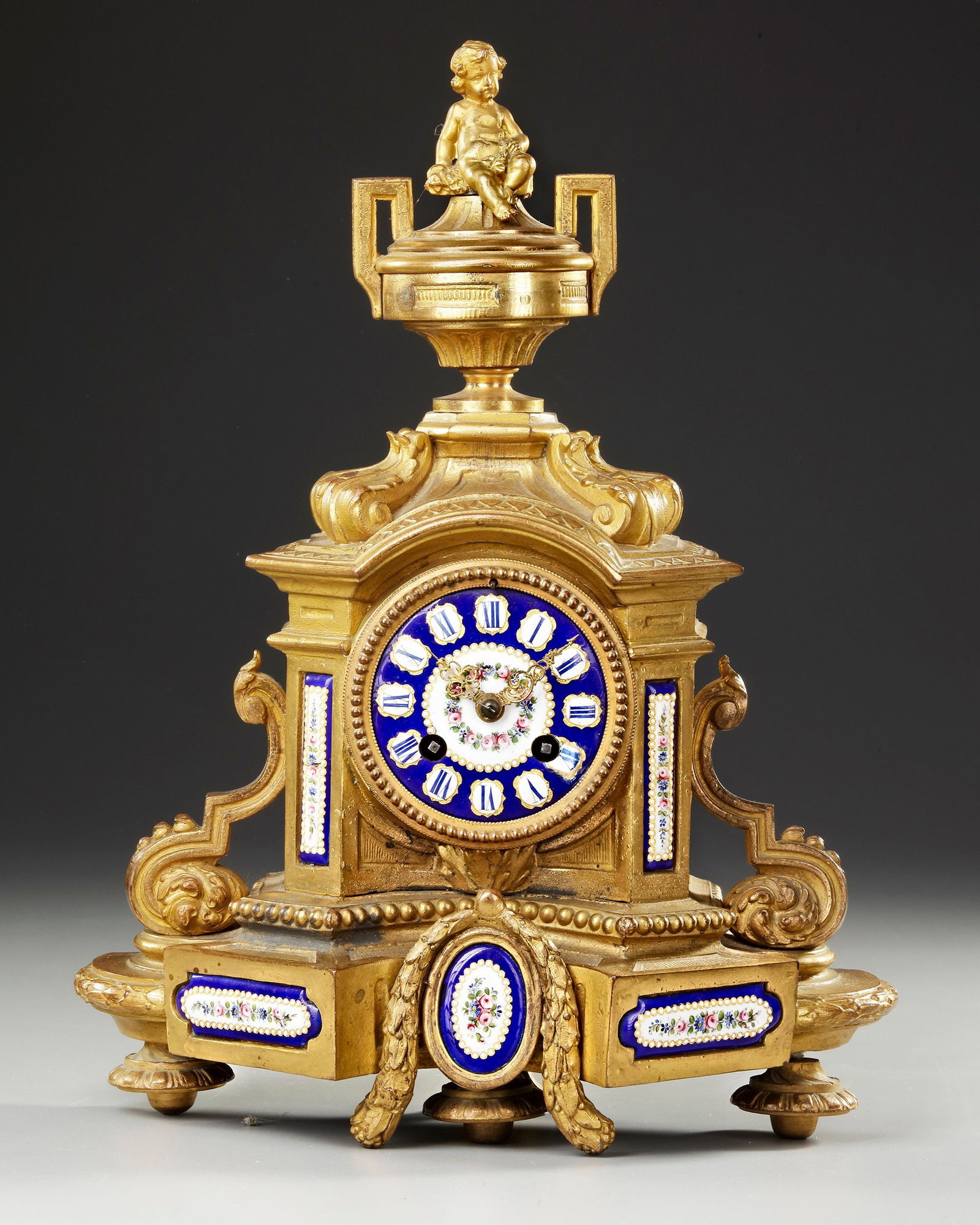 A GILT PENDULE CLOCK SEVRES, EARLY 19TH CENTURY: 28 by 38 cm.