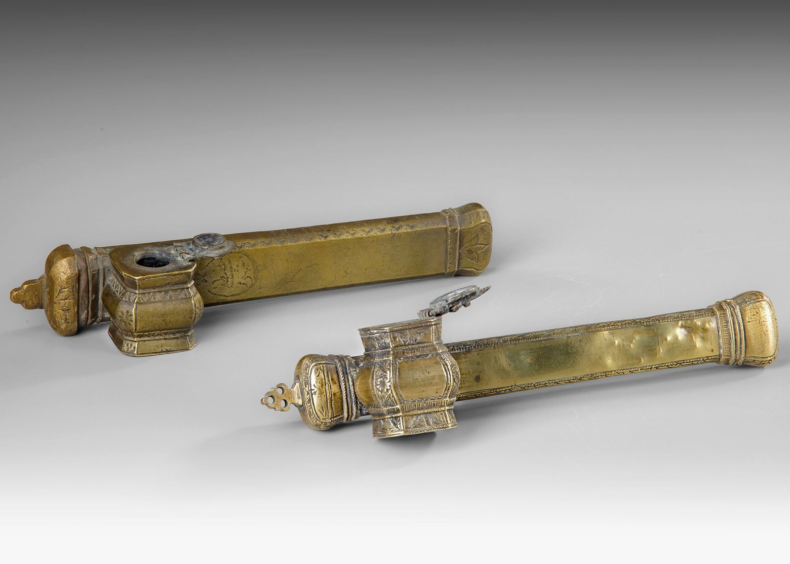 TWO OTTOMAN DIVIT QALAMDANS, 19TH CENTURY: Two Ottoman divit qalamdans represents traditional writing equipment worn by scribes and officials in the Ottoman Empire. Each piece consists of a long tubular pen case (qalamdan) attached to a small 