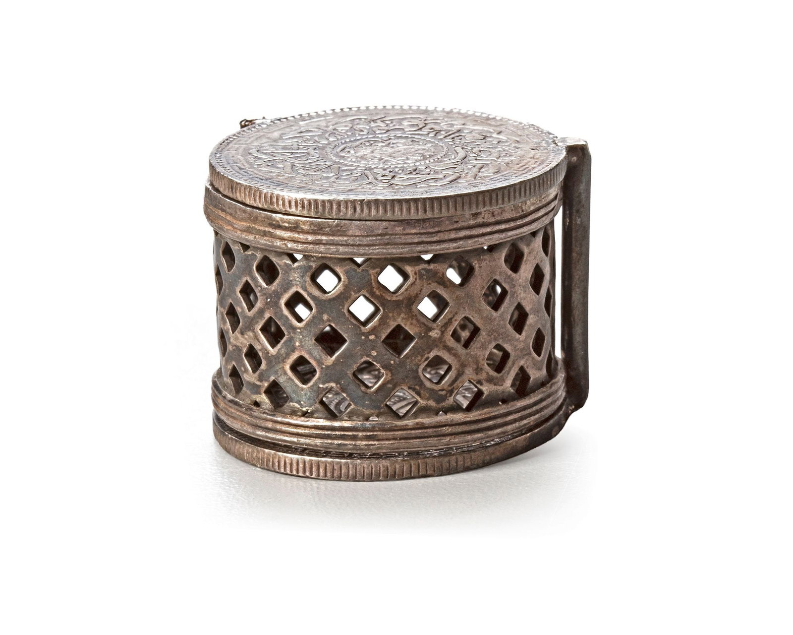 AN INDIAN SILVER INCENSE BURNER,19TH CENTURY: A rare small Indian silver incense burner, circular in form with finely pierced sides for fragrance diffusion. The hinged covers are decorated with two silver coins featuring Arabic inscriptions and a