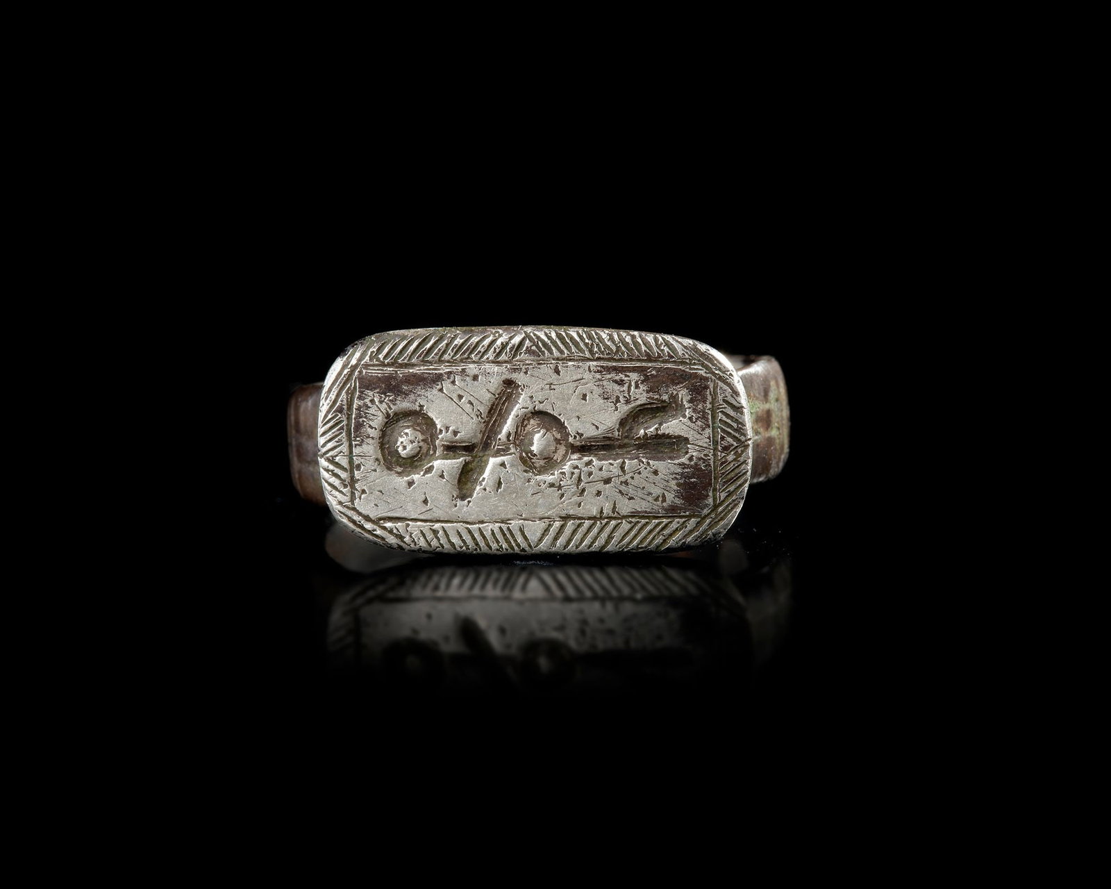 A SELJUK SILVER RING WITH ENGRAVED SEAL, ANATOLIA OR CENTRAL ASIA, 12TH-13TH CENTURY (1 of 2)