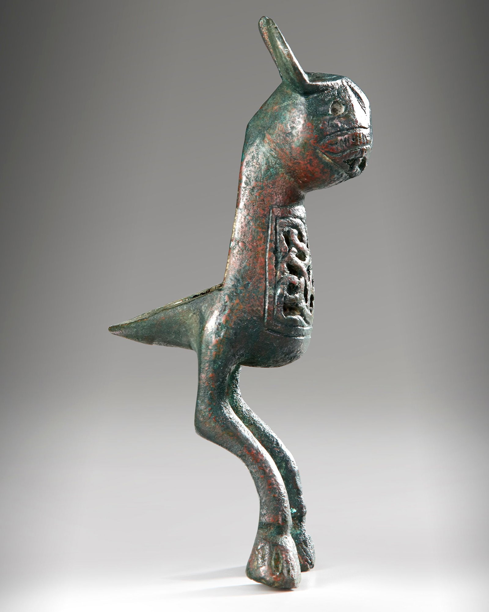 A BRONZE FINIAL IN THE FORM OF HARE, POSSIBLY FATIMID, 11TH-13TH CENTURY (1 of 5)