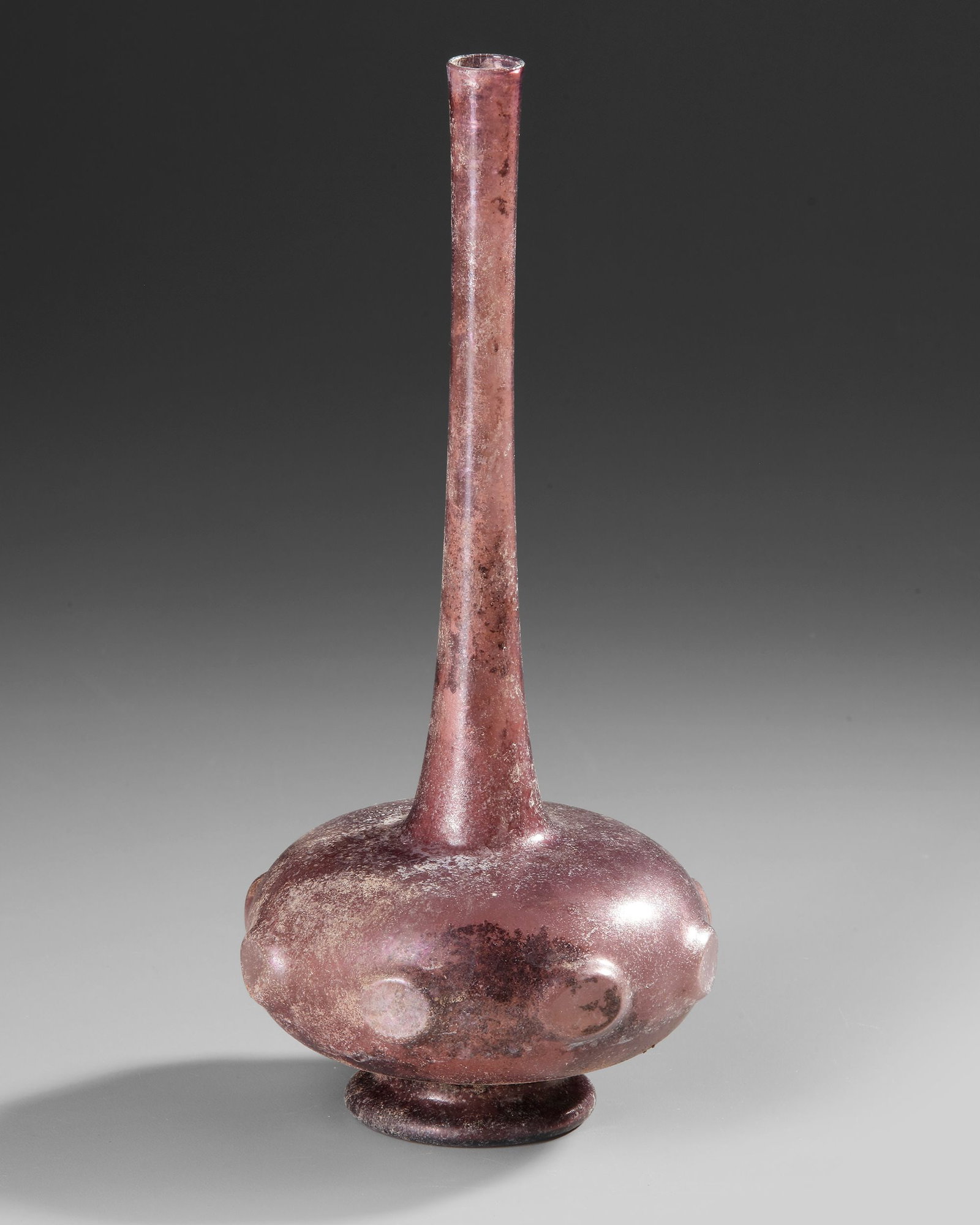 A PURPLE GLASS SPRINKLER FLASK, PERSIA OR SYRIA, 9THâ€“11TH CENTURY (1 of 4)