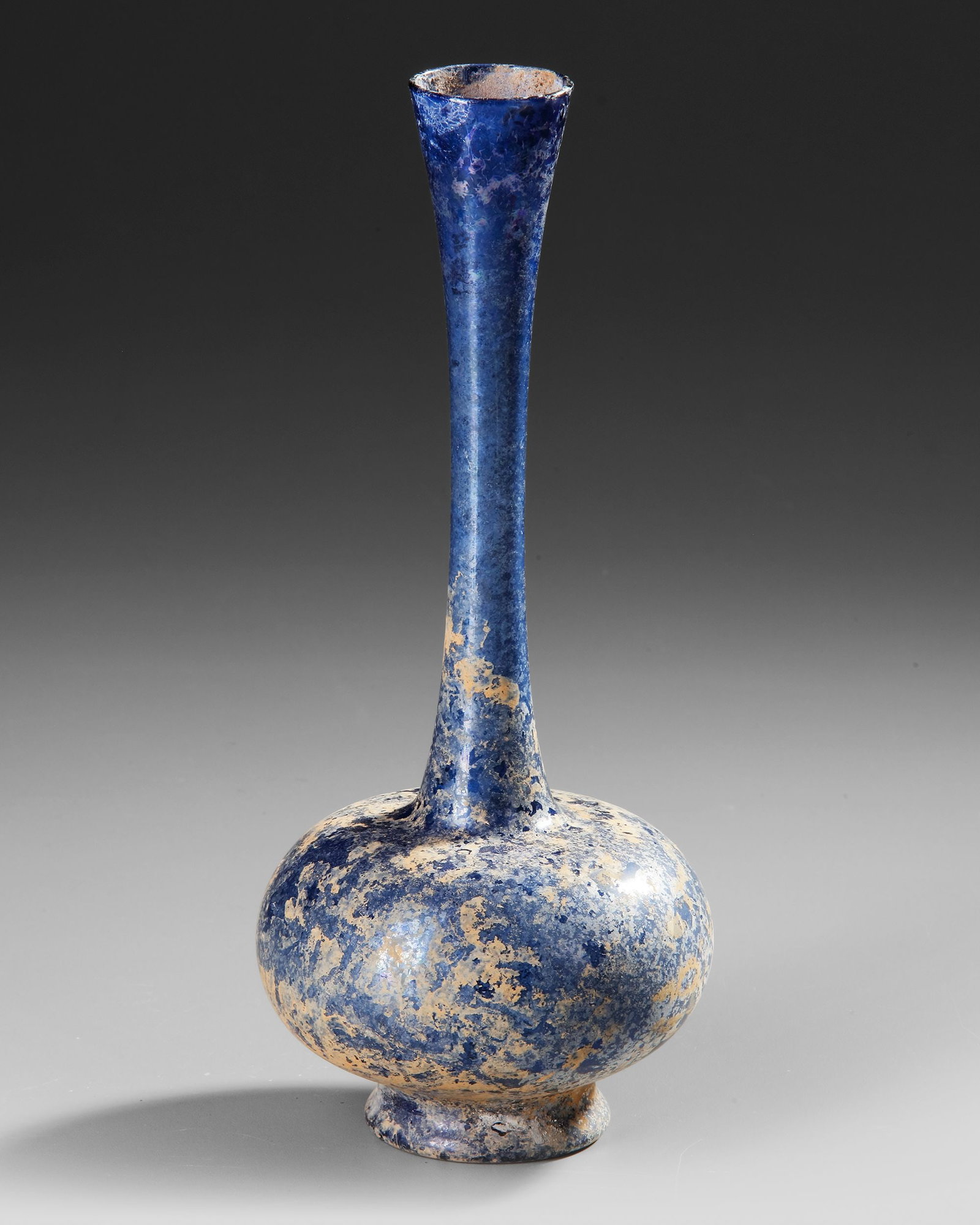 A COBALT-BLUE GLASS SPRINKLER FLASK, 9THâ€“11TH CENTURY (1 of 2)