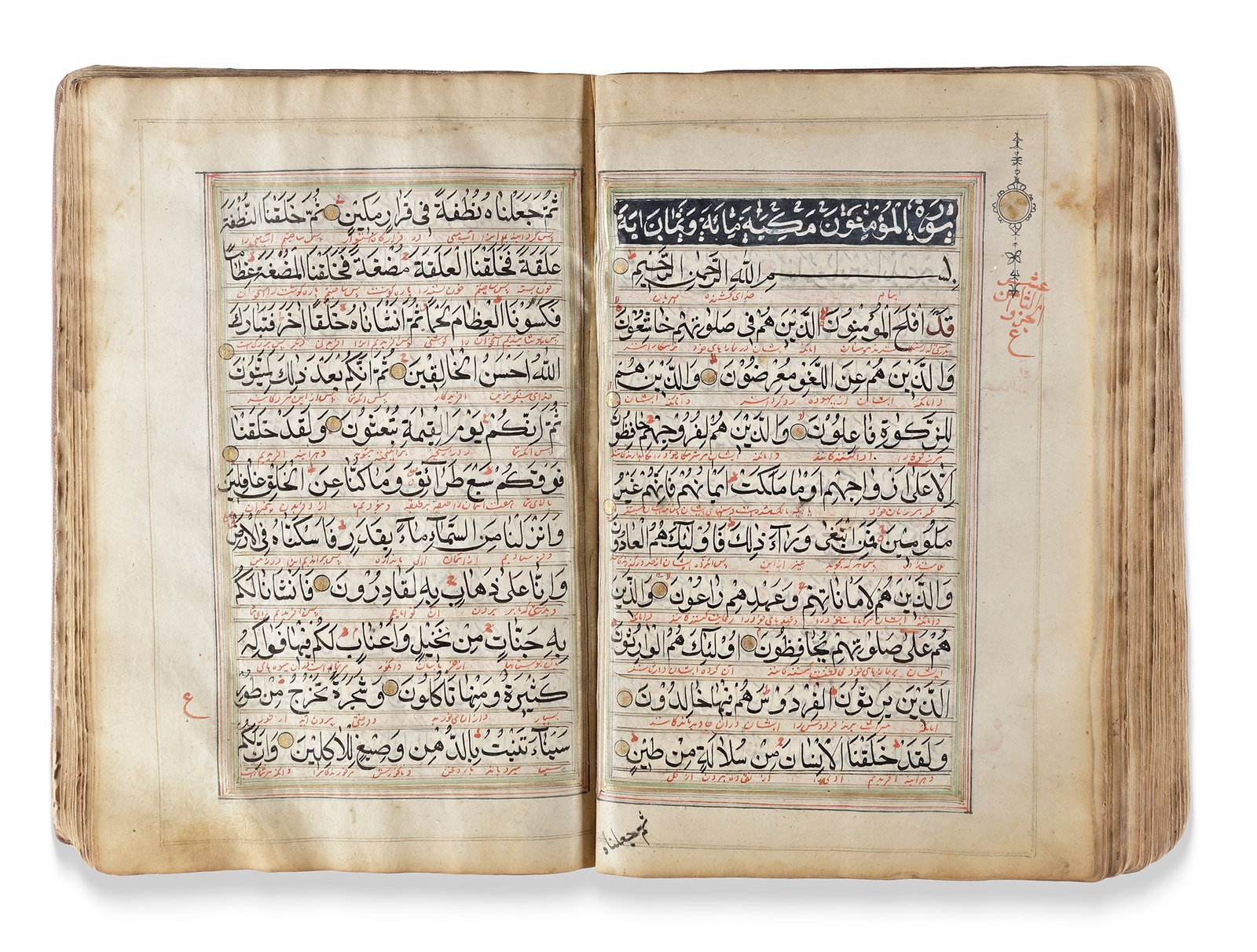 AN EARLY QAJAR ILLUMINATED QURAN, PERSIA, EARLY 19TH CENTURY: Arabic manuscript on paper, each folio with 11 lines of elegant largevblack naskh script, diacritics and vowels in red. Persian interlinear translation in red nastaliq, marginal occasional notes indic