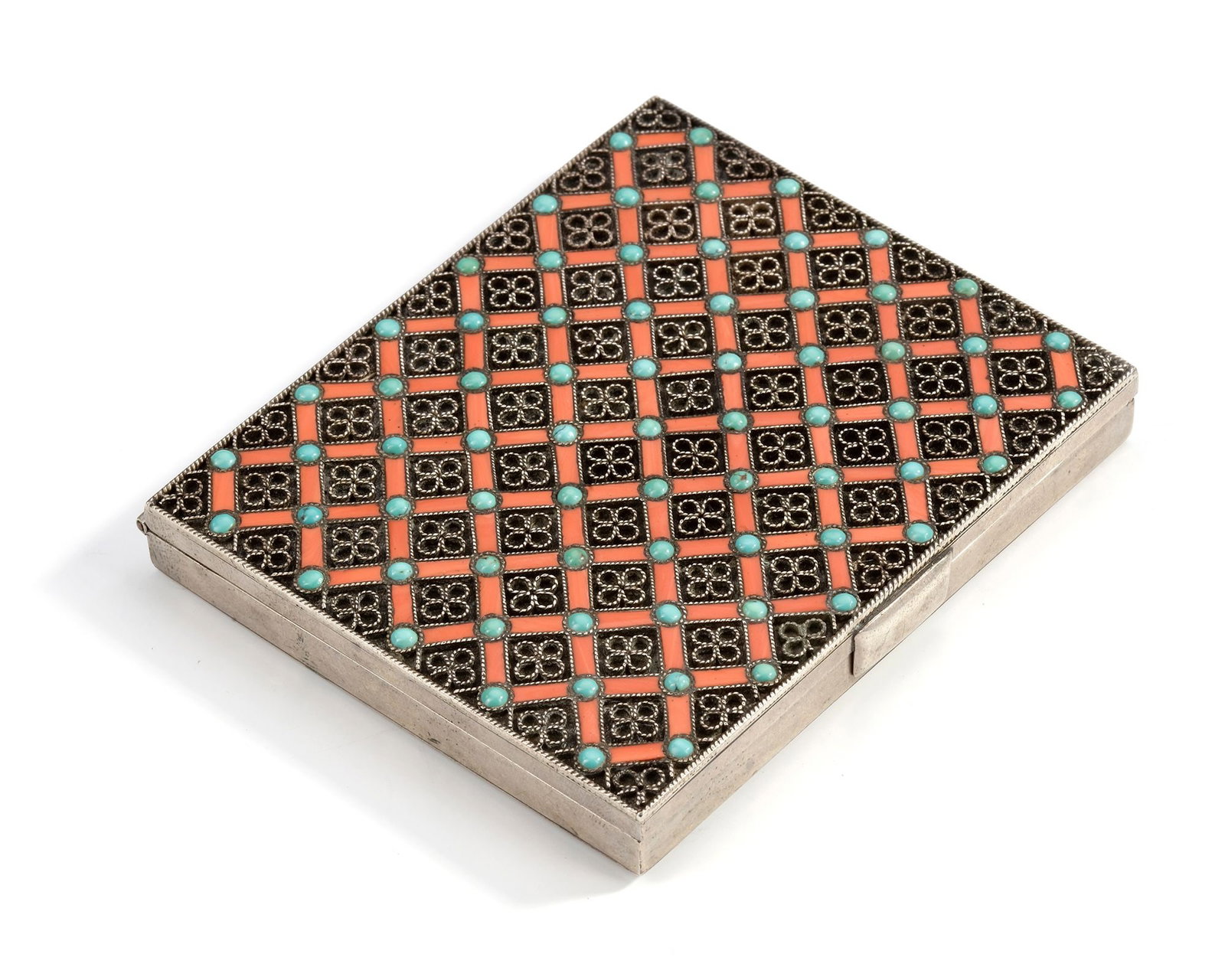 AN OTTOMAN SILVER BOX WITH CORAL AND TURQUOISE INLAY, 19TH CENTURY: Richly decorated with a geometric lattice design. The surface is inlaid with vibrant red coral and turquoise stones, framed by delicate silverwork. ca. 9 by 8 cm. 139 gr. THE DR. SAAD AL-JADIR COLLECT