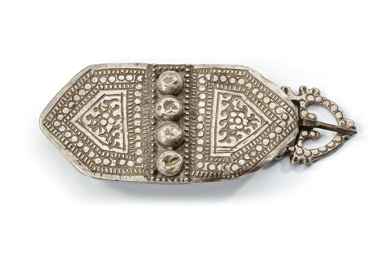 AN OTTOMAN SILVER BELT BUCKLE, 19TH CENTURY: An ornate 19th-century Ottoman silver belt buckle, finely crafted with geometric and floral motifs in relief. The piece features intricate decoration with raised domes, detailed borders, and a sturdy 