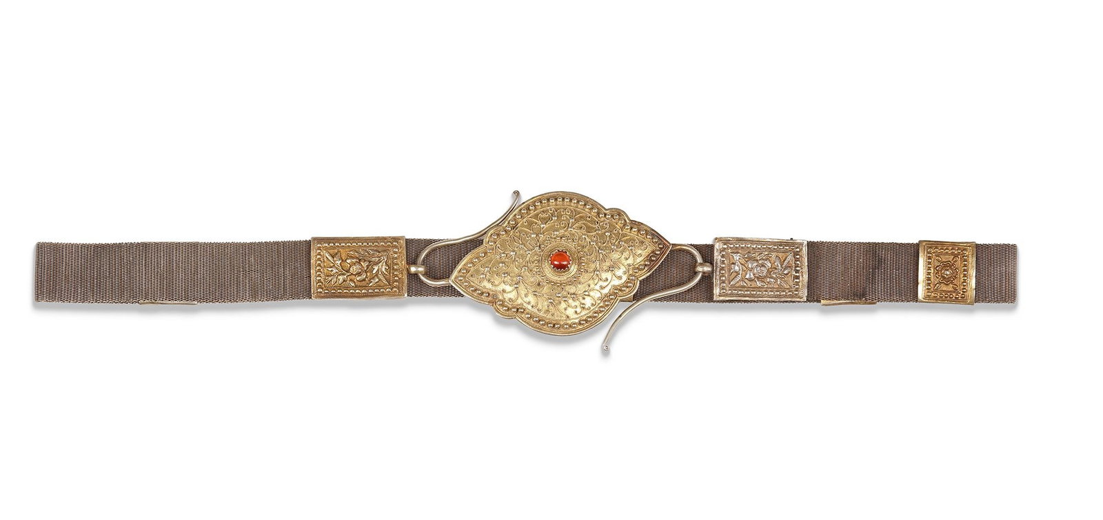 AN OTTOMAN SILVER BELT, 19TH CENTURY: Richly decorated with gilt details, floral motifs, and a central clasp set with a red stone. 80 by 3 cm. 173 gr. THE DR. SAAD AL-JADIR COLLECTION