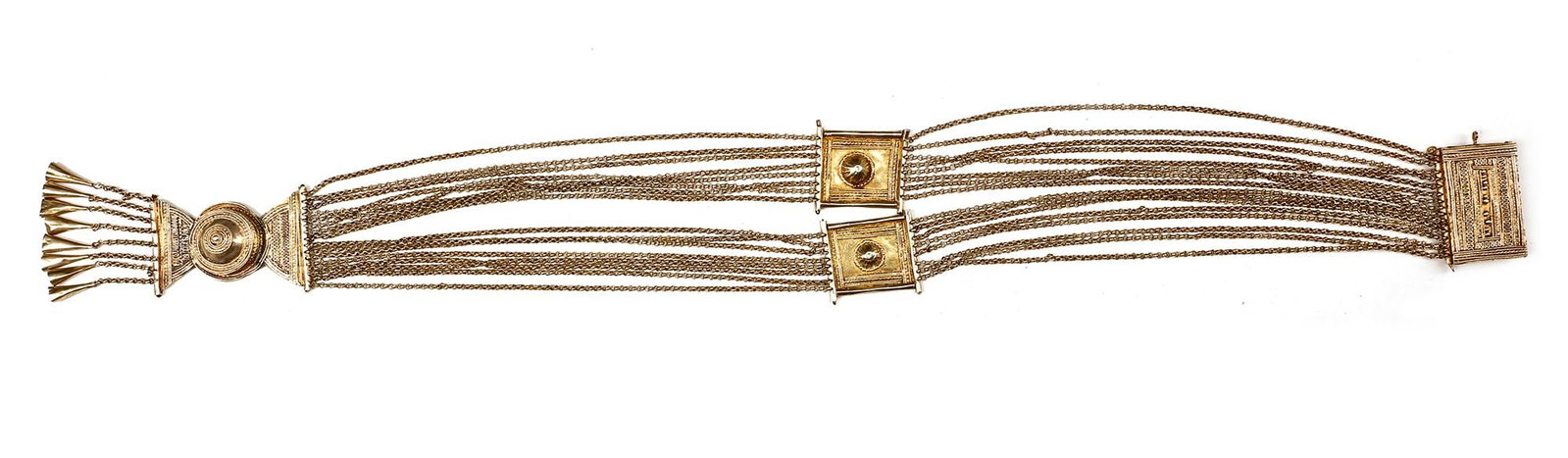 AN OTTOMAN SILVER BELT, 19TH CENTURY: With multiple chains and ornate clasps with detailed geometric and floral designs. 57 by 3 cm. 145 gr. THE DR. SAAD AL-JADIR COLLECTION