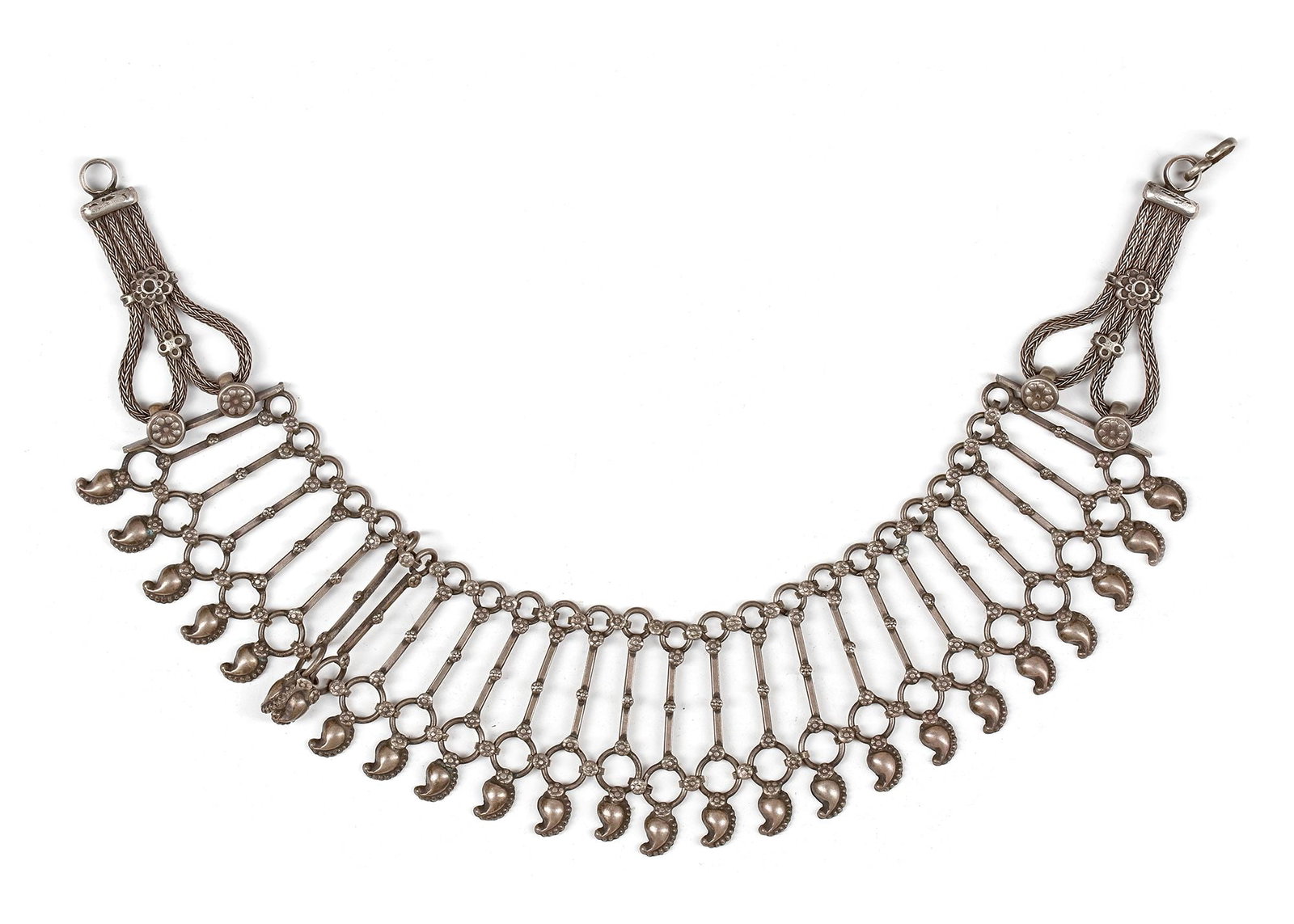 AN ISLAMIC SILVER NECKLACE, YEMEN, 19TH CENTURY: Composed of linked tubular and circular elements with crescent-shaped dangles, braided silver wire terminals and floral details. 138 gr. THE DR. SAAD AL-JADIR COLLECTION