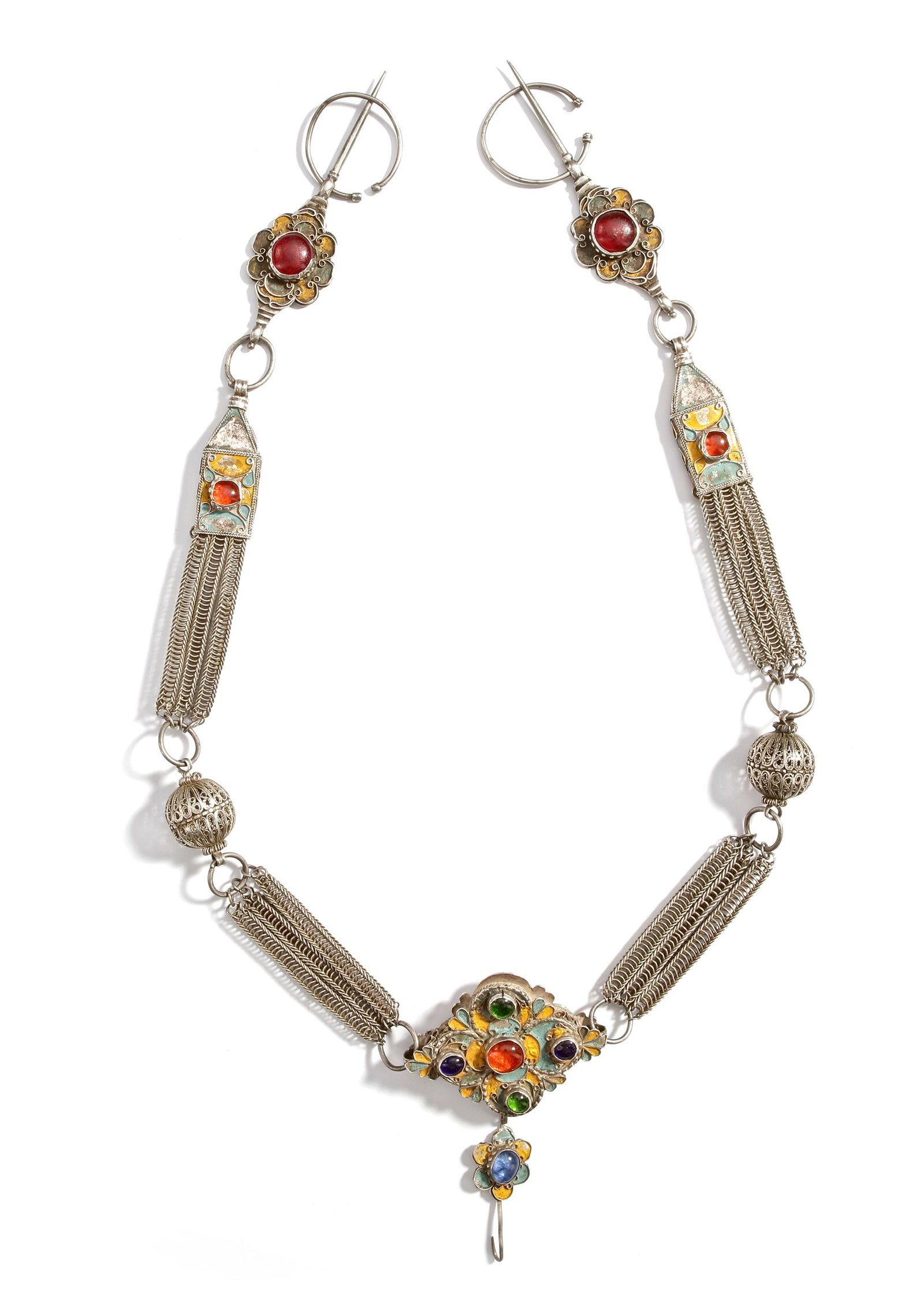 A SILVER NECKLACE, MOROCCO, 19TH CENTURY: Richly decorated with filigree work, enamel detailing, and set with colorful cabochon stones. Featuring ornate chain segments, openwork beads, and a bold central pendant. ca. 90 cm. 260 gr. THE DR. SA