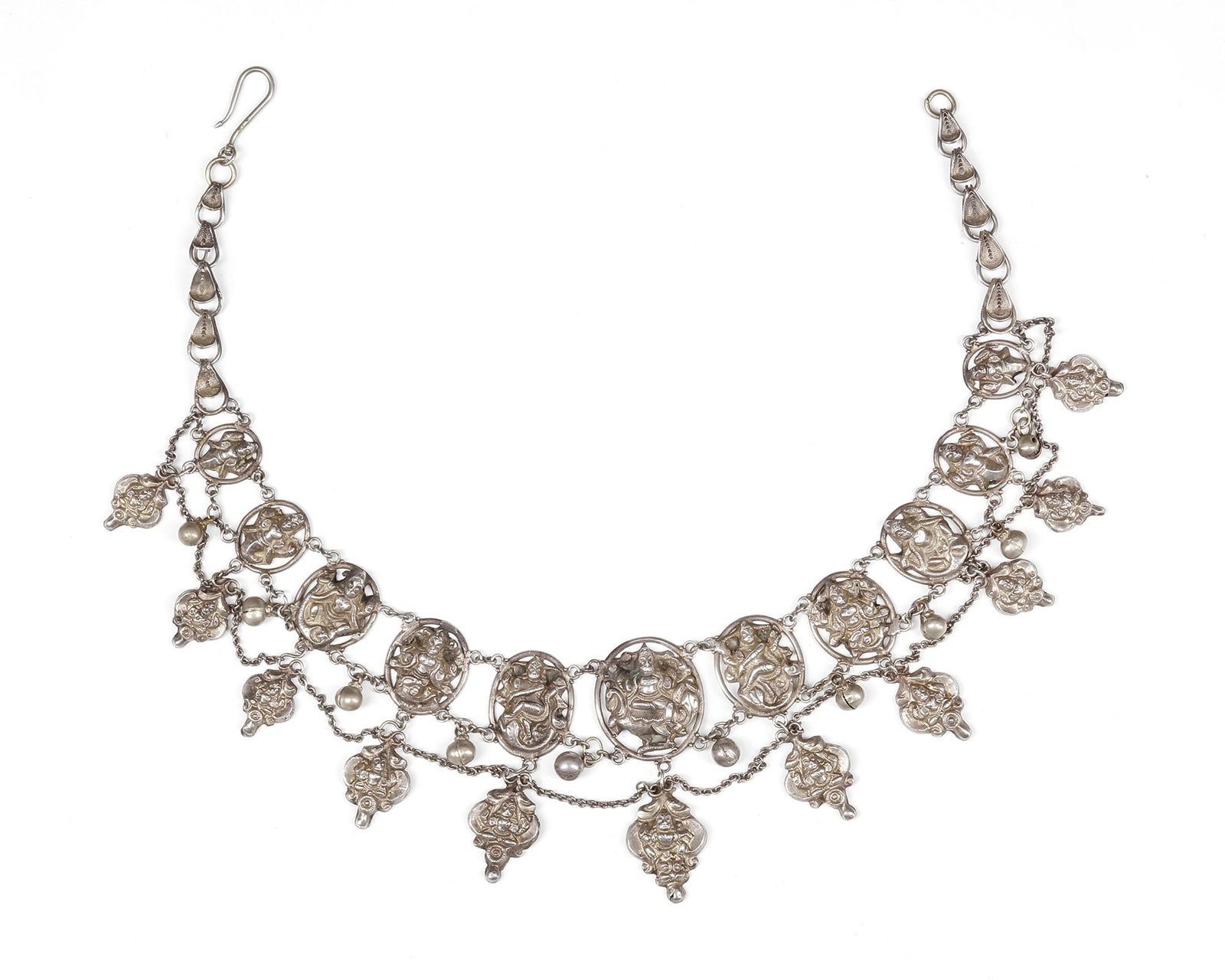 A SILVER NECKLACE, INDIA, 20TH CENTURY: Featuring ornate plaques with finely cast deity figures in high relief. The design is enriched with small dangling elements and bead-like pendants. 43 by 10 cm. 92 gr. THE DR. SAAD AL-JADIR COLLECTION