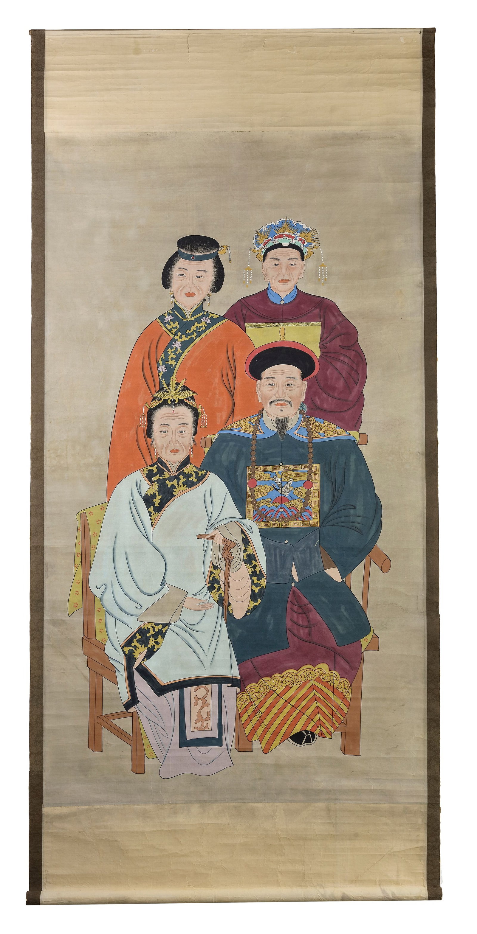 A CHINESE ANCESTRAL PORTRAIT, QING DYNASTY (1644-1911): Ink and colour on paper, depicting a male figure and three female figures. 180 by 85 cm.