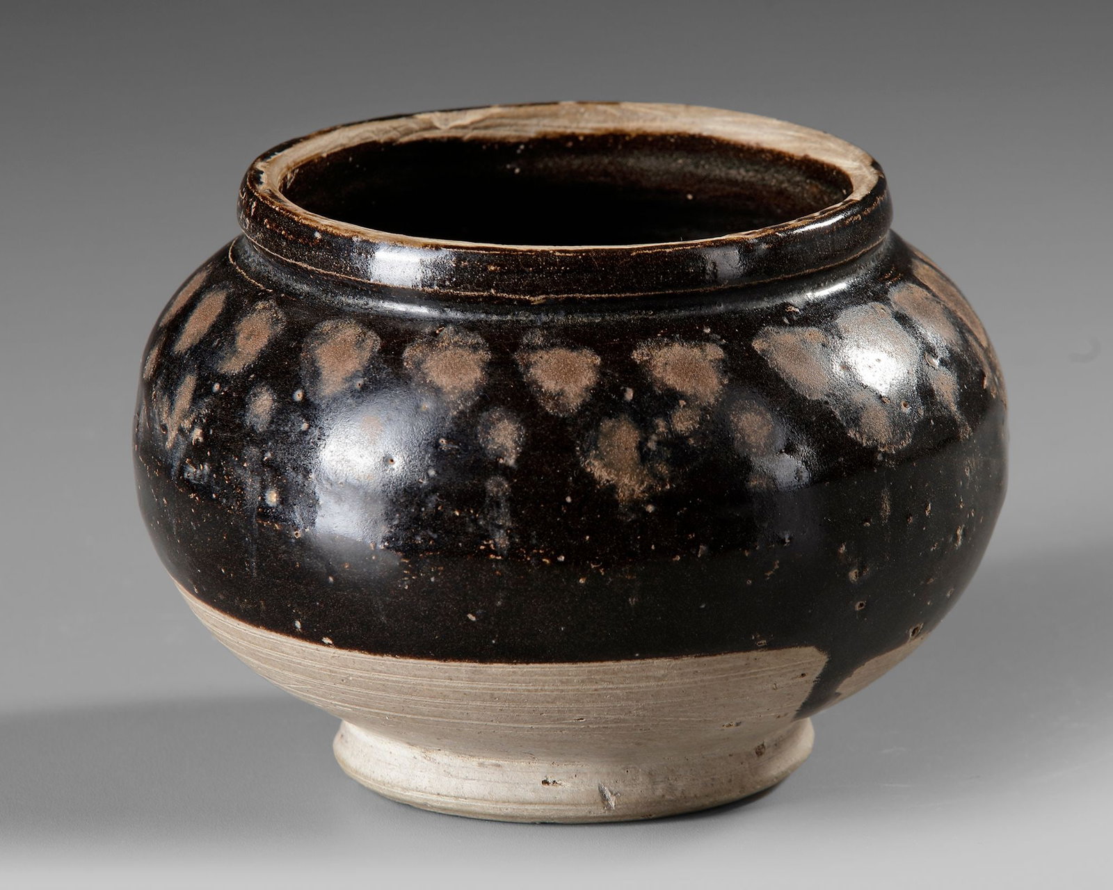 A CHINESE CIZHOU RUSSET-SPLASHED BLACK-GLAZED JAR (1 of 4)
