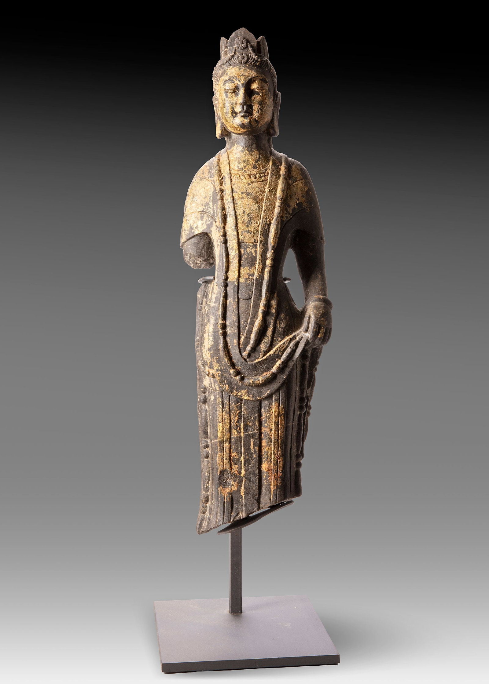 A FINELY CARVED STONE FIGURE OF A STANDING BUDDHIST DEITY (1 of 7)