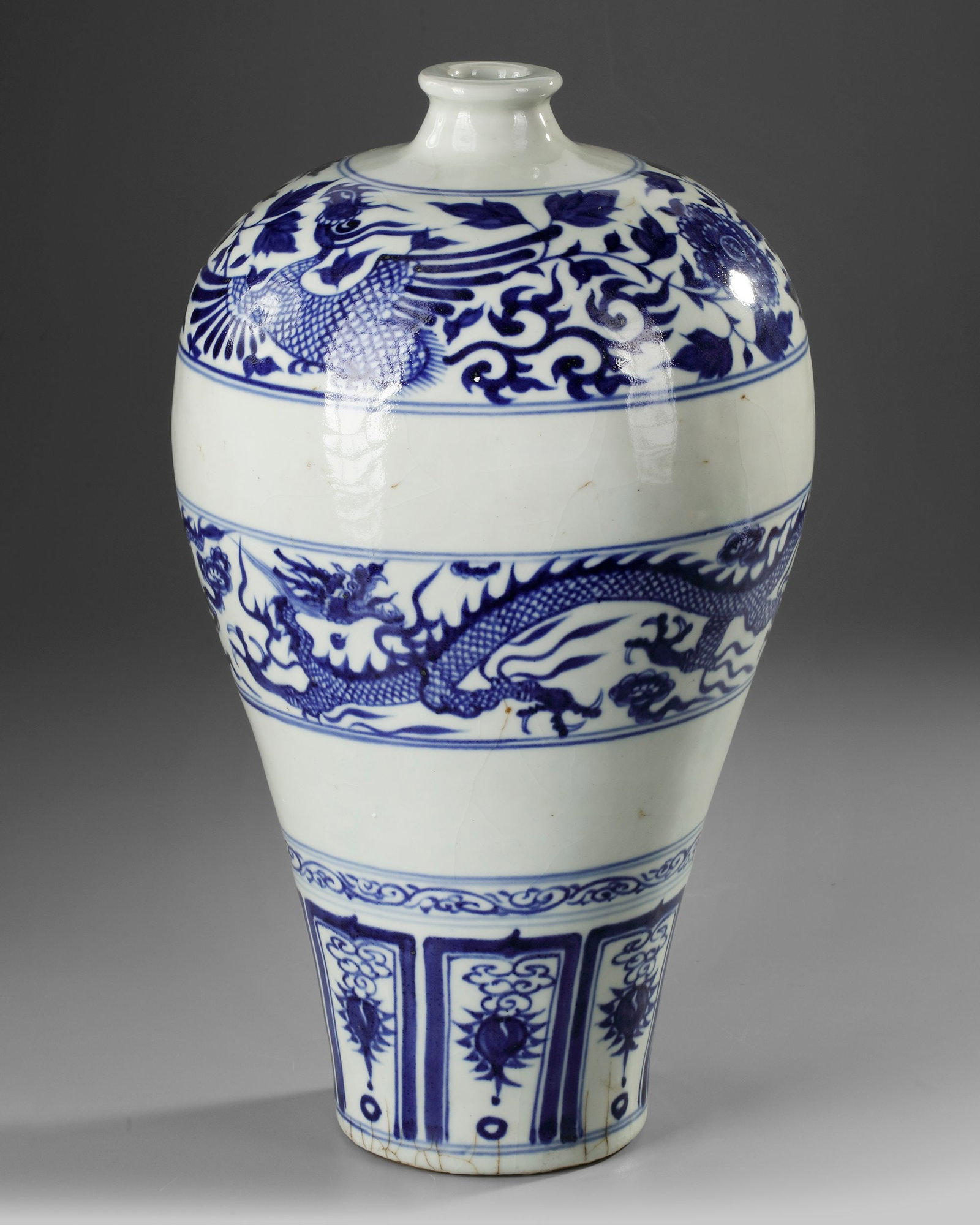 A LARGE CHINESE BLUE AND WHITE MEIPING VASE, YUAN DYNASTY (1271-1368) OR LATER: Robustly potted with high broad round shoulders sloping down towards the tapering ovoid body, painted in rich cobalt blue tones, the main register with a wide band enclosing a pair of scrolling dragon