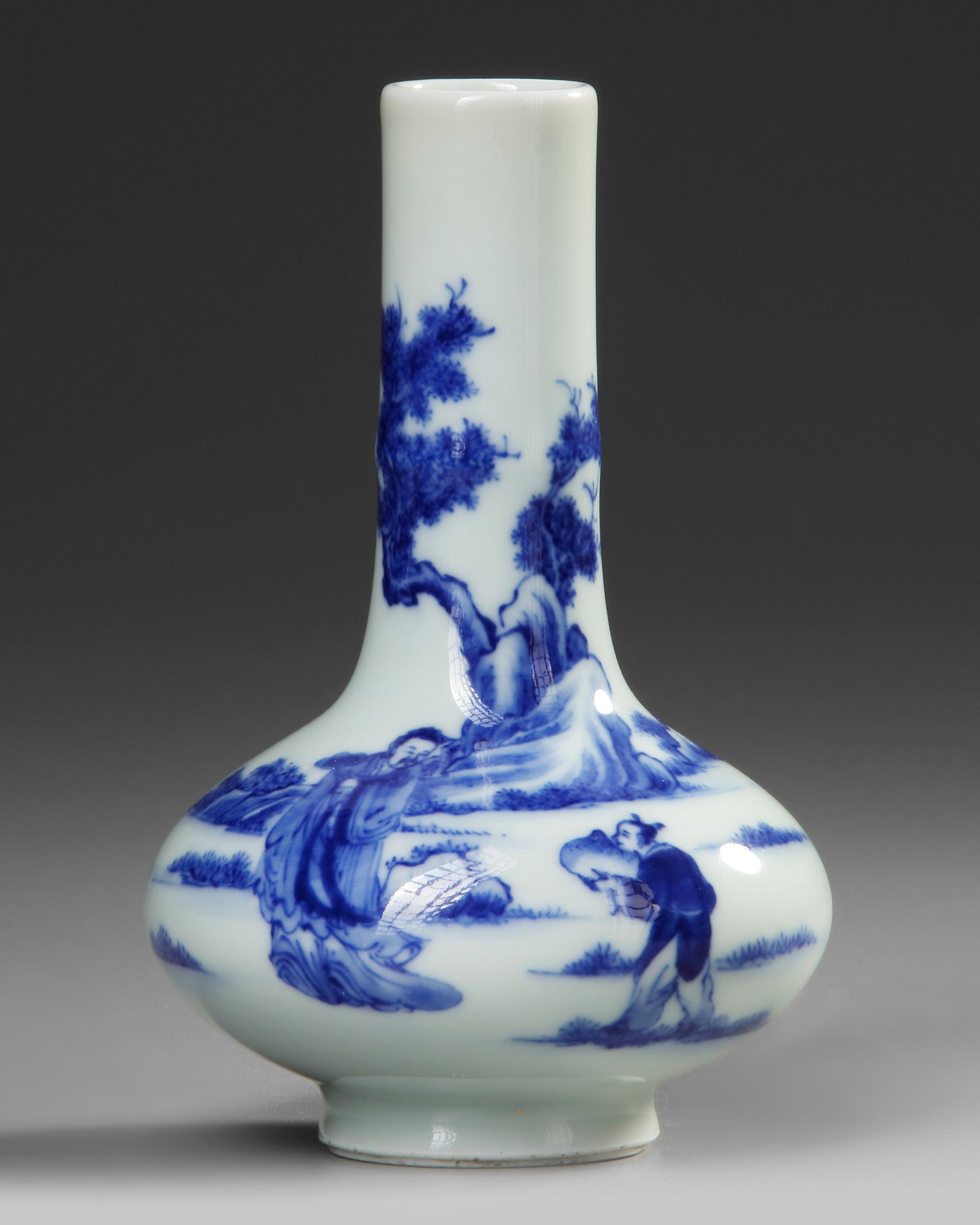 A SMALL CHINESE BLUE AND WHITE VASE, 19TH-20TH CENTURY: A Chinese porcelain bottle vase, decorated in cobalt blue with a scholar and his servant in pine tree landscape, the bottom with a Chinese Kangxi six character mark. Height: 14 cm.