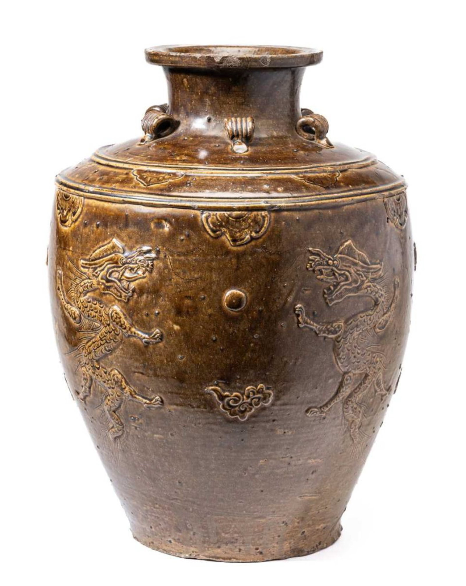A LARGE CHINESE MARTABAN OLIVE-GREEN GLAZED'DRAGON' JAR, 16TH CENTURY: the baluster body rising from a recessed base to an angled shoulder and short waisted neck with everted rim, moulded around the exterior withdragons in pursuit of a pearl amidst cloud scrolls, the sho