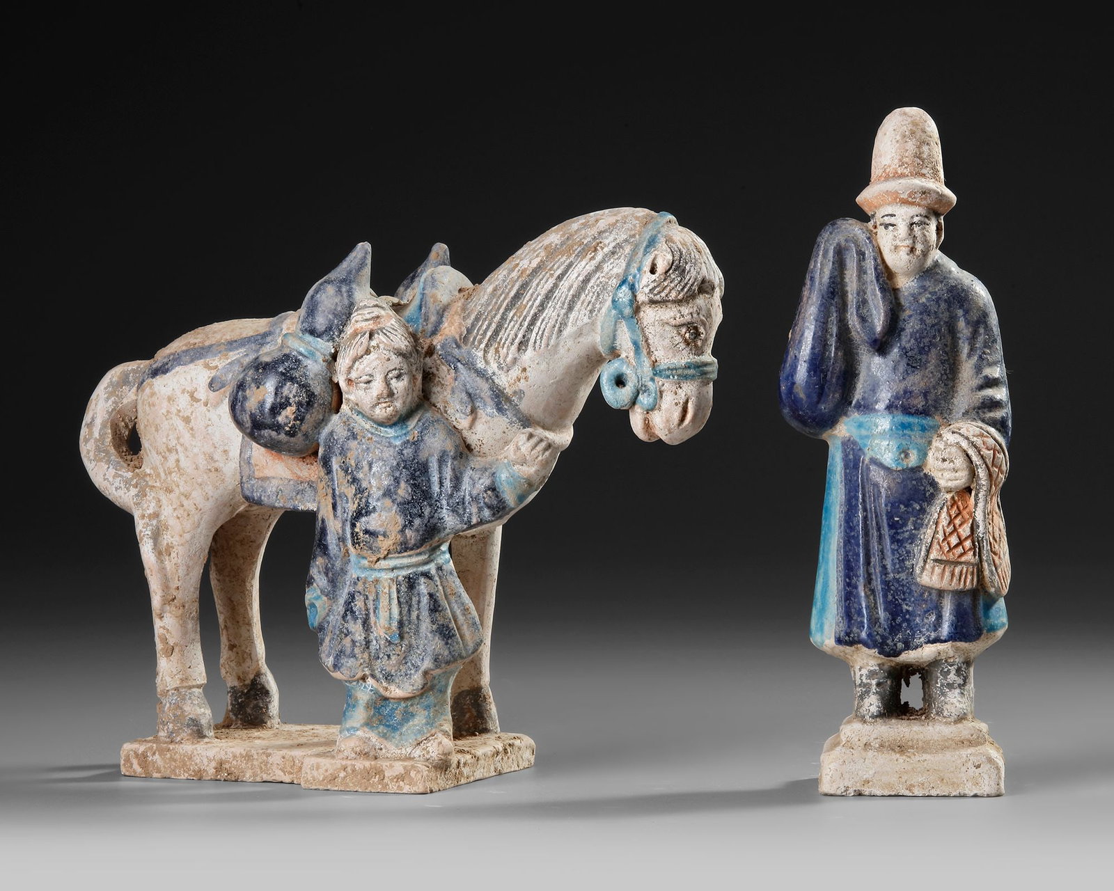 A CHINESE FAHUA GLAZED HORSE WITH GROOM AND A CHINESE OFFICIAL, MING DYNASTY (1368-1644): 19 cm. 17 by 16 by 10 cm.