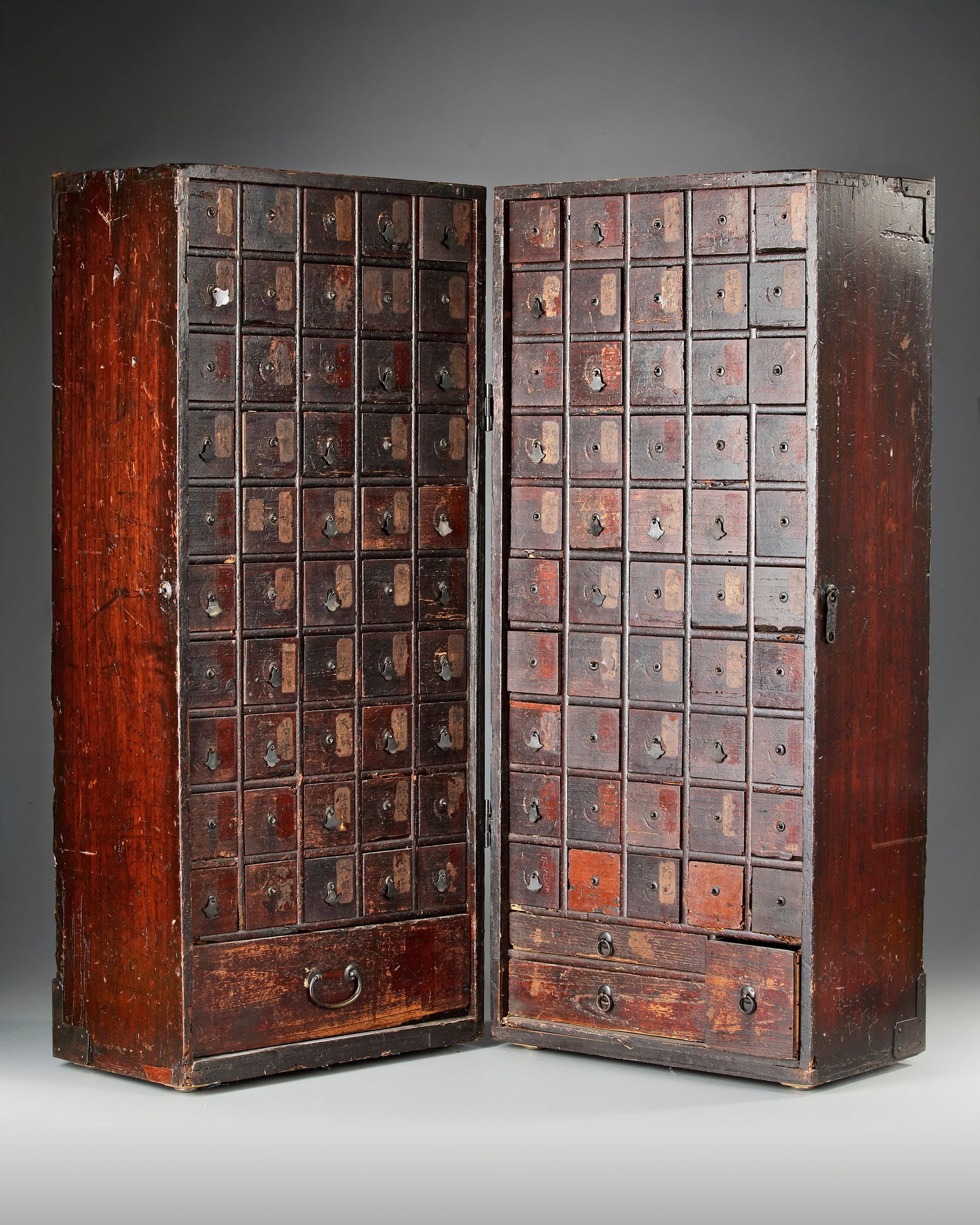 A JAPANESE KIRI WOOD MEDICINE CHEST (KUSURI TANSU) 19TH CENTURY: Height 83 cm. Width 37.5 cm.