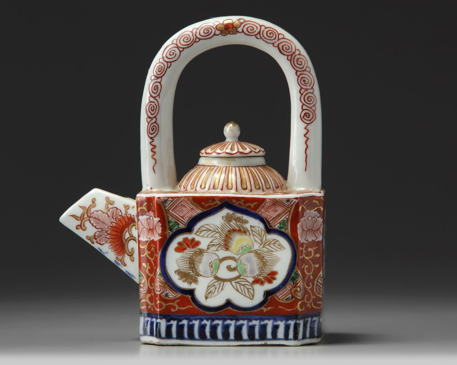 A JAPANESE IMARI-ARCH-HANDLES TEAPOT AND COVER, 19TH CENTURY (1 of 5)