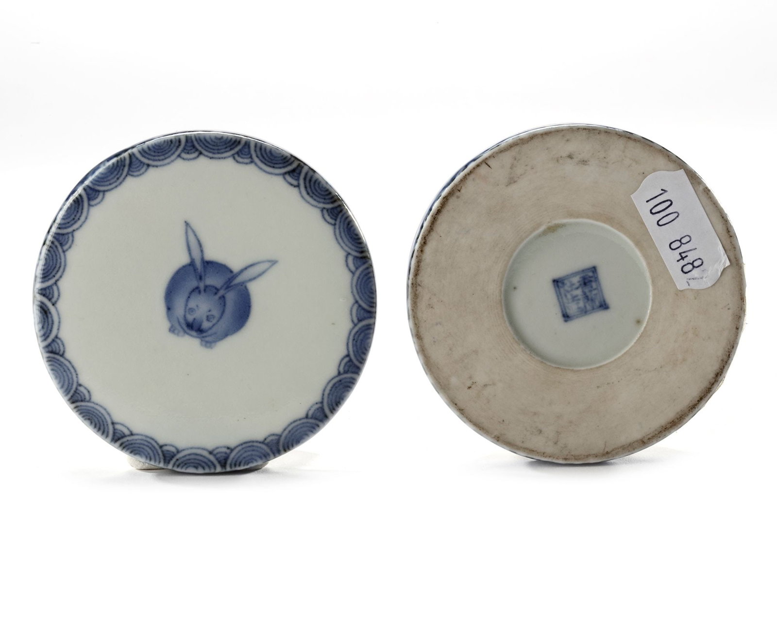 A JAPANESE BLUE AND WHITE KORANSHA BOX WITH HARE, MEIJI PERIOD (1868-1912): A Japanese porcelain box of cylindrical shape, the two parts fitting snugly together. The flat top is painted in underglaze blue with a hare, seen head on and sitting with large ears spreads out. Arou