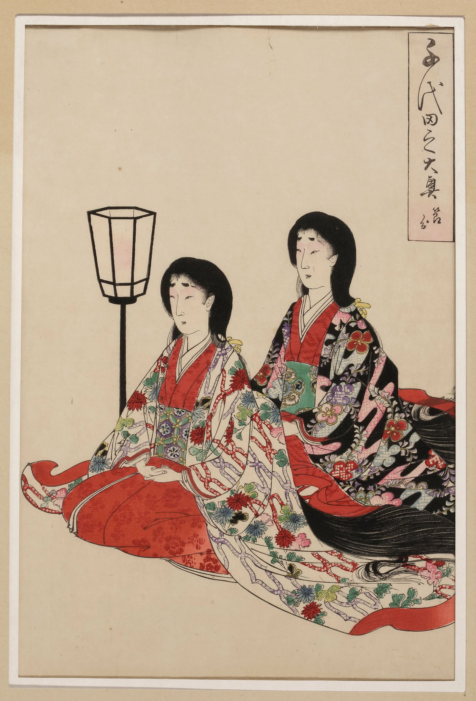 A JAPANESE WOODBLOCK PRINT, TOYOHARA CHIKANOBU, CIRCA 1890: A delicate woodblock print depicting two women in elegant Heian-era kimono, seated gracefully beside a standing lantern. 34.5 by 22.7 cm. With passe-partout 50 by 35.7 cm.