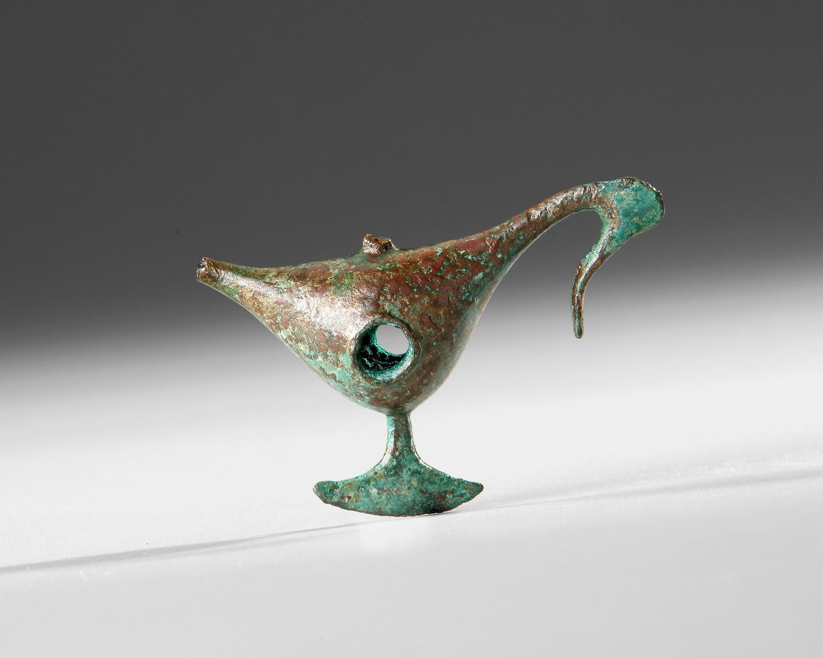 A GREEK GEOMETRIC BIRD FIGURE, 6TH CENTURY BC (1 of 2)