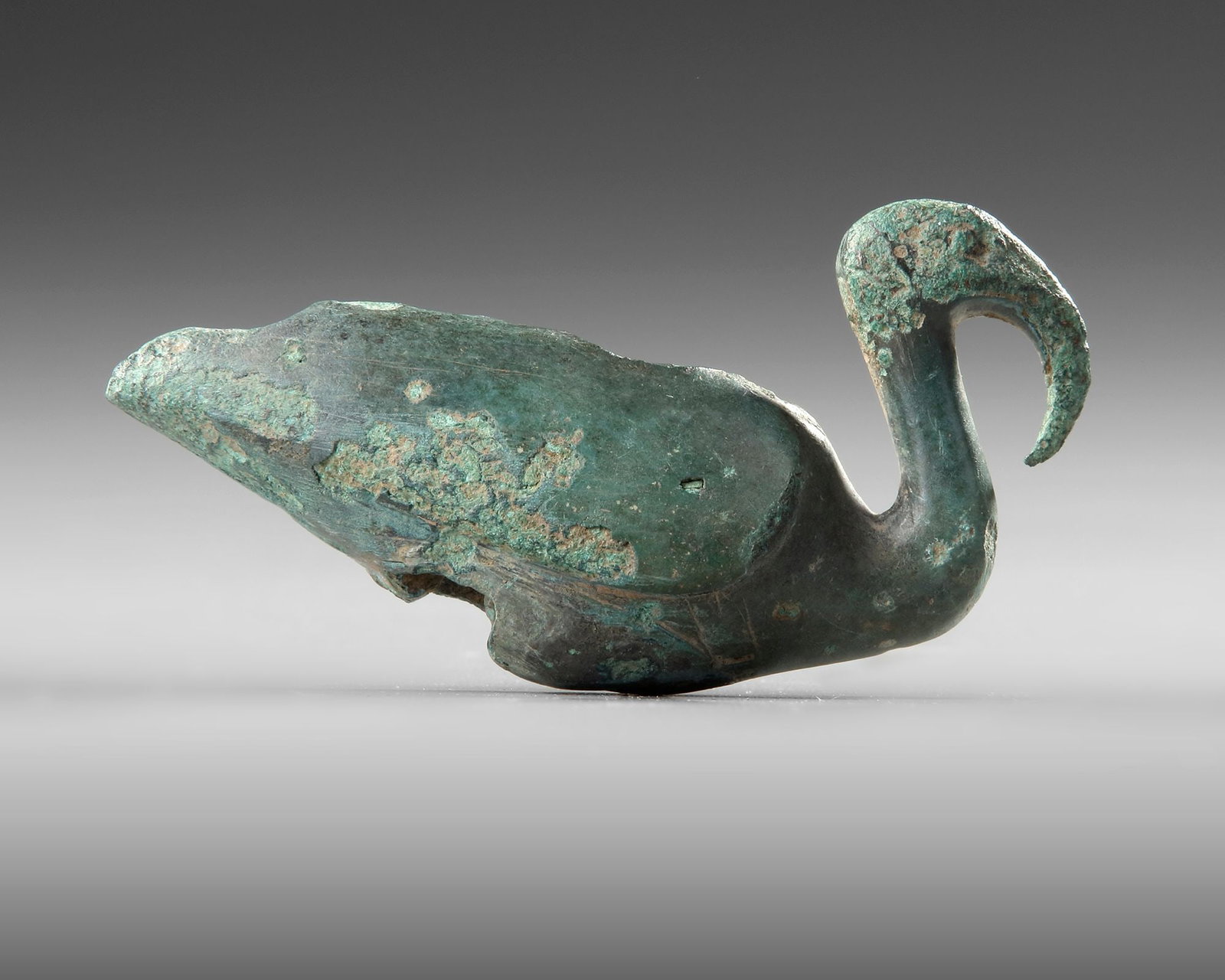 A ROMAN SEATED IBIS, 1ST CENTURY BC-1ST CENTURY AD: Length 9 cm. Height 5 cm. Width 3 cm. PROVENANCE Private collection, Germany before 1990