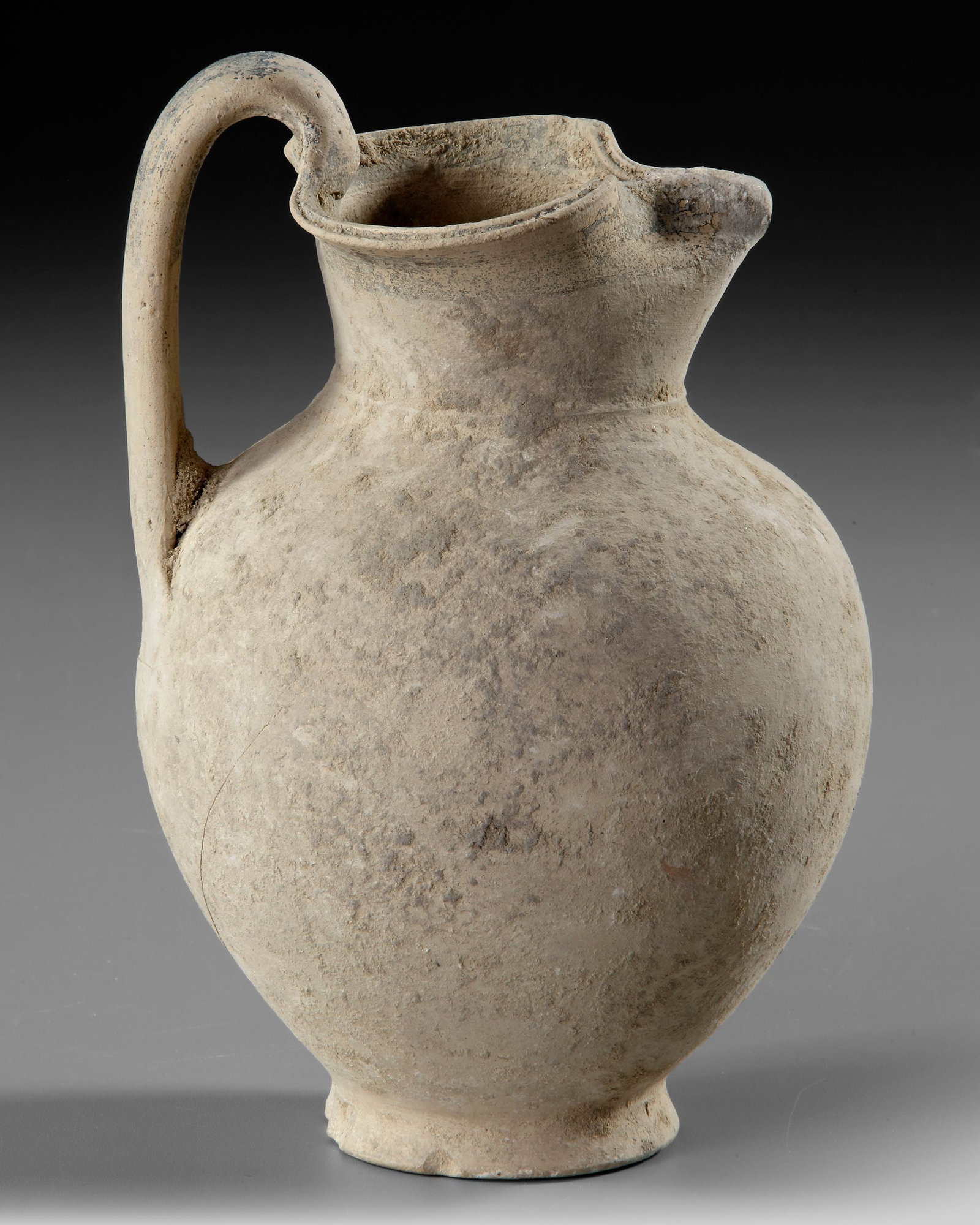 A GREEK OINOCHOE, 3RD - 2ND CENTURY BC: Height 19.5 cm.