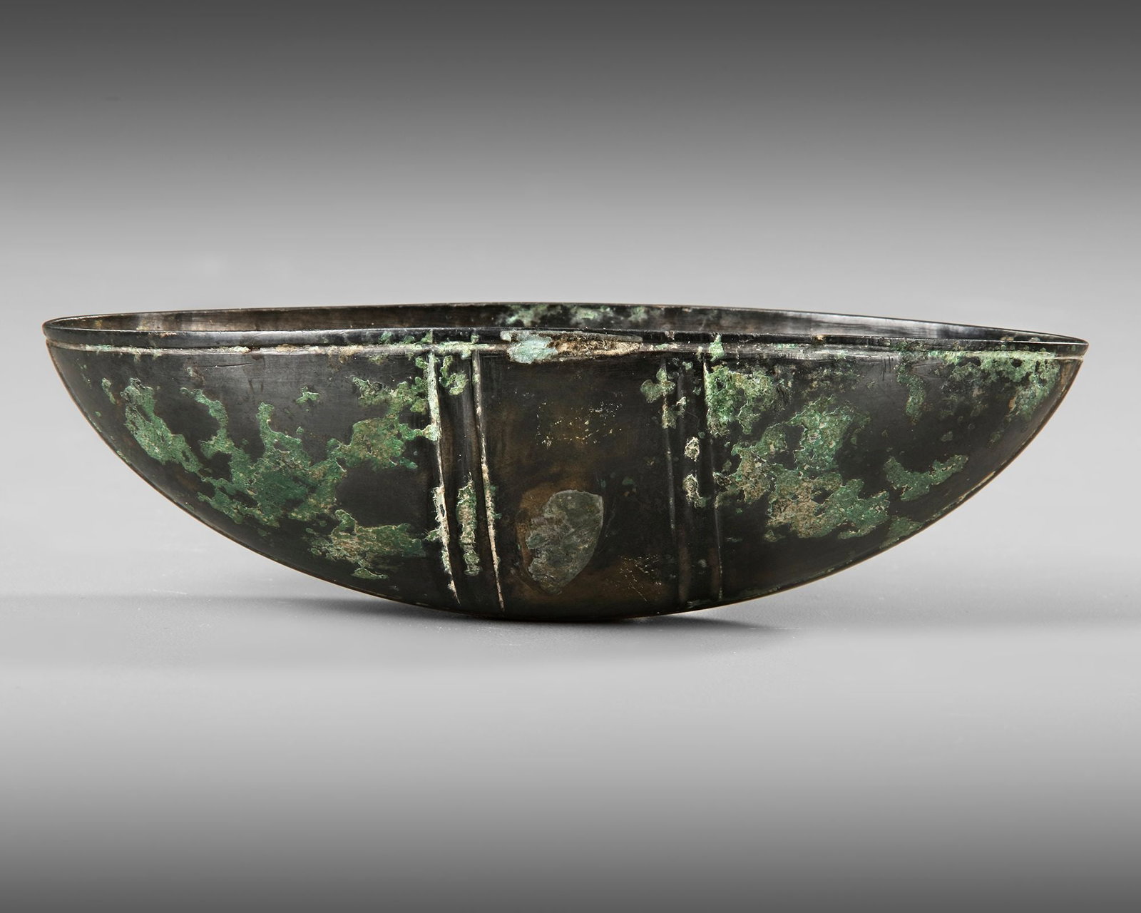 A BRONZE SASSANIAN CUP, 6TH CENTURY AD: Great patina. Length: 15 cm. PROVENANCE Private collection, Germany before 1990