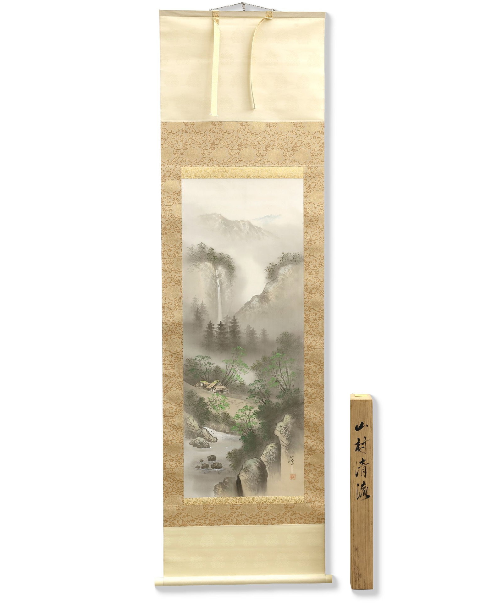 A JAPANESE HANGING SCROLL 'MOUNTAIN VILLAGE IN THE MIST', 20TH CENTURY: Ink and light colors on paper. A beautifully executed Japanese hanging scroll depicting a tranquil mountain landscape shrouded in soft mist. A secluded village rests beside a winding stream, surrounde