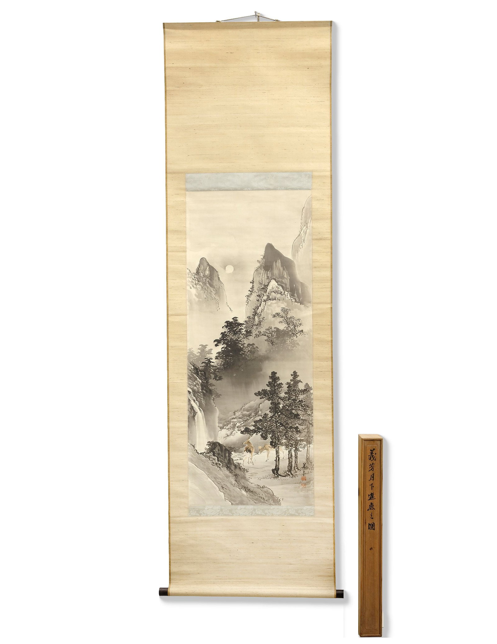 A SCROLL PAINTING DEPICTING A DEER IN A LANDSCAPE, CHINA, 20TH CENTURY: A graceful Chinese hanging scroll painting depicting deer in a peaceful mountain valley surrounded by misty peaks, waterfalls, and pine trees. Rendered in delicate ink tones, the scene symbolizes long