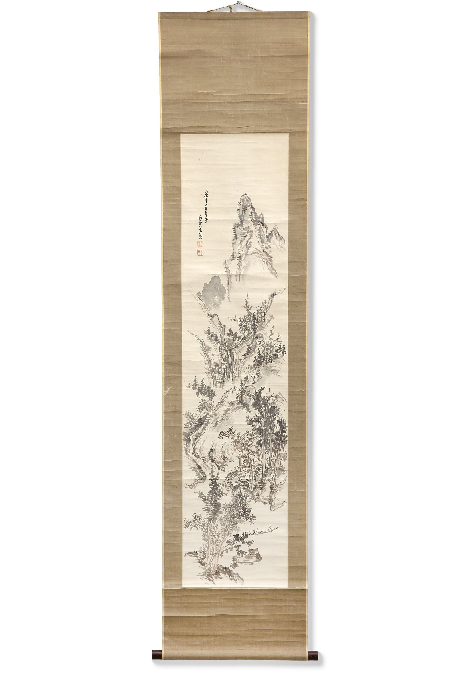 A MOUNTAIN LANDSCAPE, 20TH CENTURY: An elegant Japanese hanging scroll featuring a tranquil mountain landscape rendered in expressive ink brushwork. Towering peaks, winding paths. 185 by 43 cm. Vintage condition with age-related creases