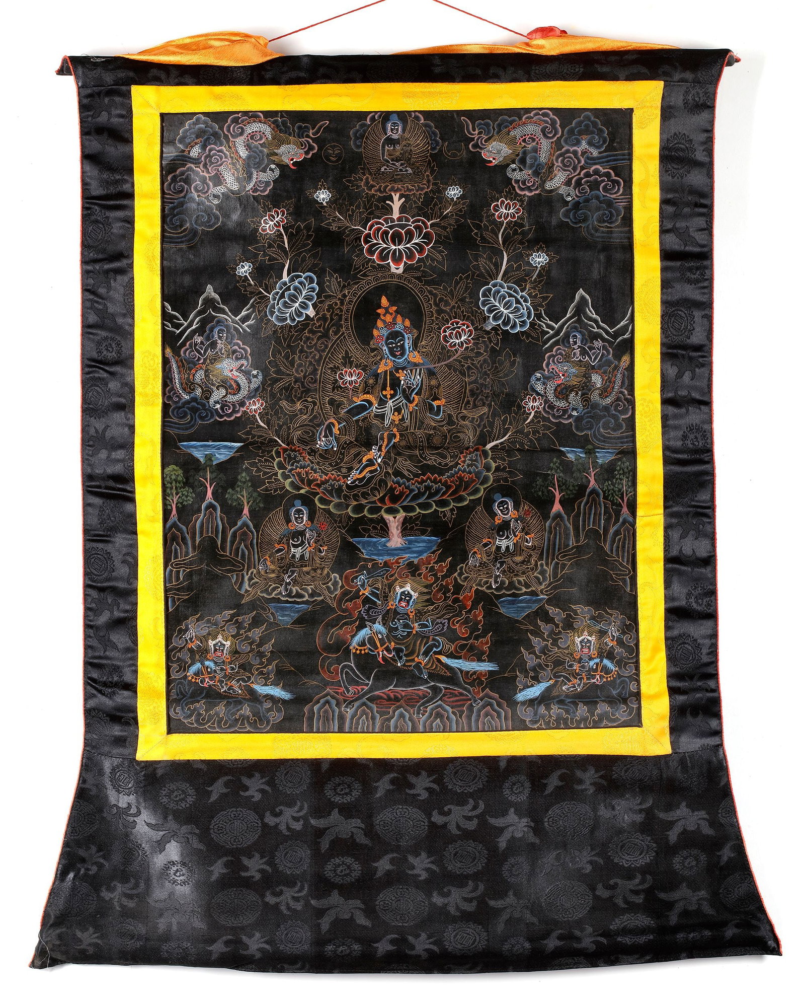 A BLACK GROUND THANGKA OF BUDDHIST DEITIES, TIBET, 20TH CENTURY (1 of 1)