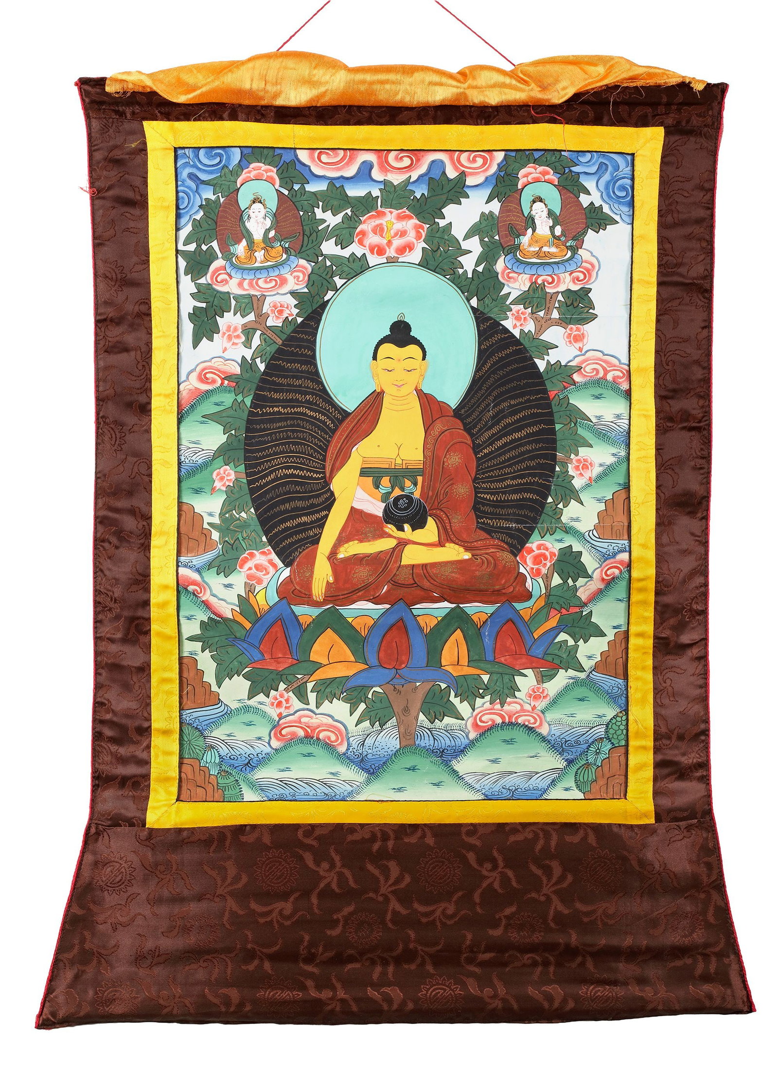 A MEDICINE BUDDHA THANGKA, TIBET, 20TH CENTURY: A vibrant Tibetan thangka depicting the Medicine Buddha seated in meditation upon a lotus throne, holding the healing bowl that symbolizes wisdom and restorative power. Flanked by attendant bodhisattv
