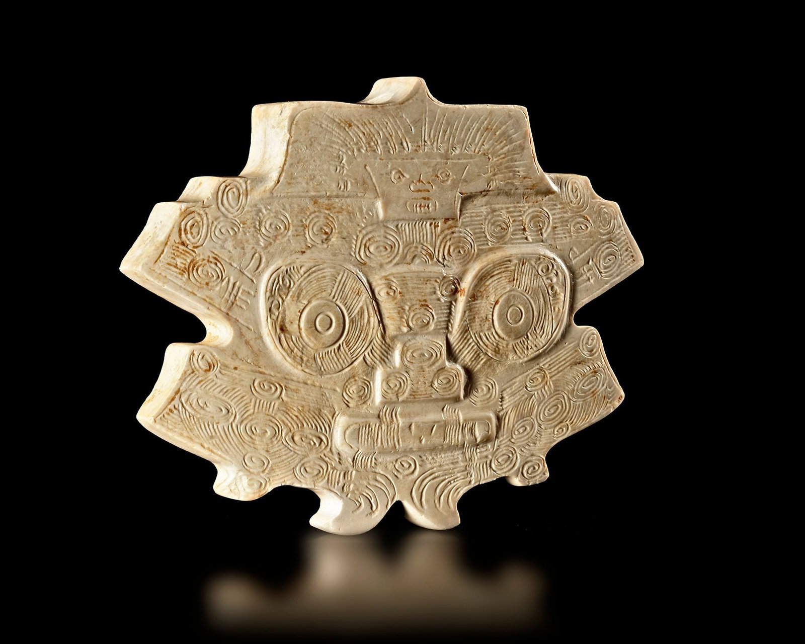 A CREAMY WHITE JADE PENDANT OF A BEAST FACE, CHINA, LIANGZHU CULTURE (1 of 3)