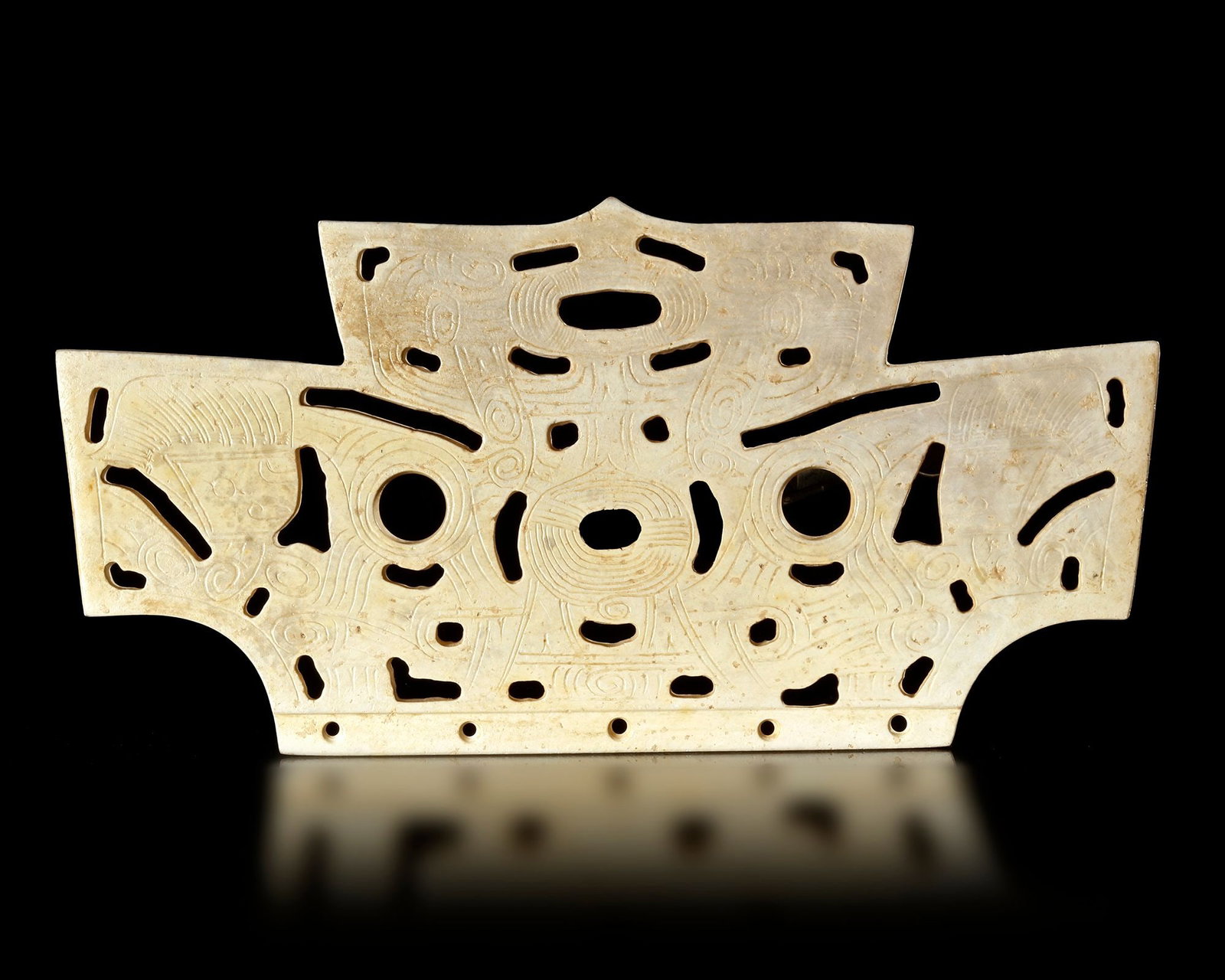 A CREAMY WHITE JADE TRAPEZOID HAT ORNAMENT, CHINA, LIANGZHU CULTURE: 15, 8 cm. PROVENANCE Purchased in 1996 from Mr. Frank H. Crane, a Canadian antique dealer. His shop, "The Hundred Antiques" was located in Stirling, Ontario, Canada. Reference: "Chinese jade selected 