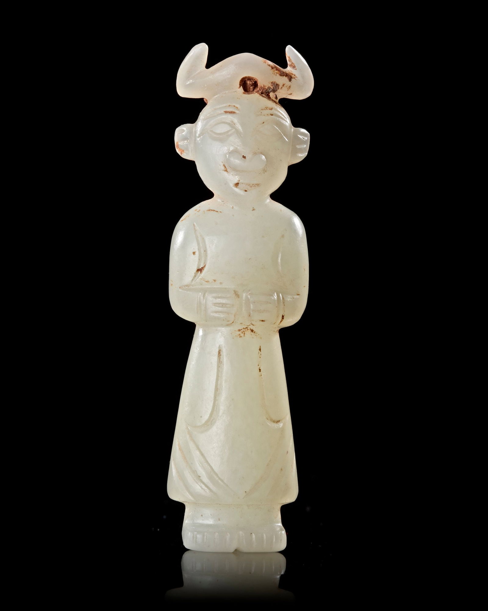 A HORNED JADE STANDING FIGURE, WESTERN HAN DYNASTY (206 BCâ€“9 AD): A finely carved white jade figure standing in a dignified pose, adorned with a distinctive horned headdress. The serene facial features and flowing robe reflect the elegance and spiritual symbolism of