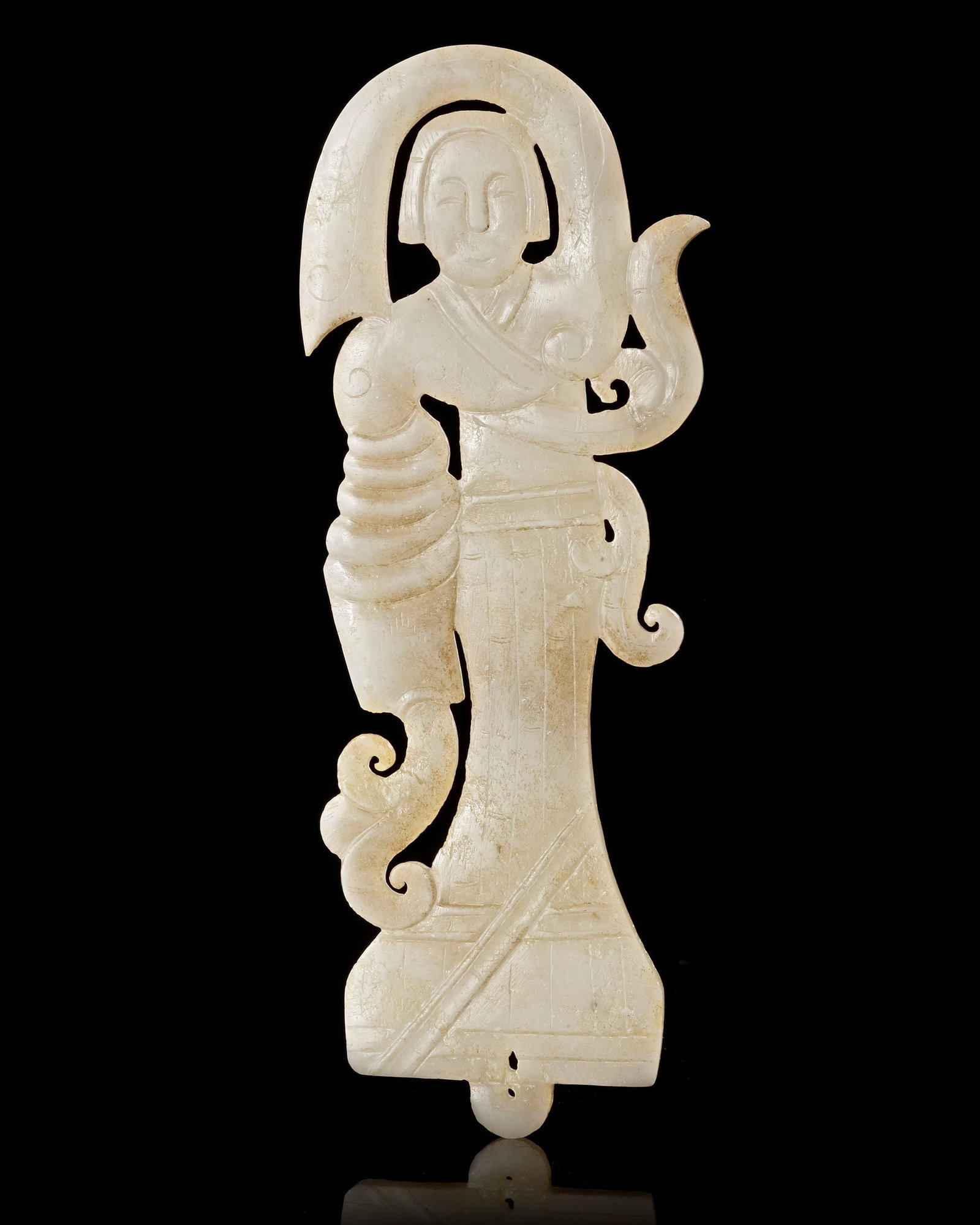 A CHINESE WHITE JADE OF A DANCER, WESTERN HAN DYNASTY (206 BCâ€“9 AD): A finely carved white jade dancer from the Western Han dynasty, depicted in a graceful standing pose with flowing sleeves and elegant drapery. The openwork design and delicate craftsmanship capture th