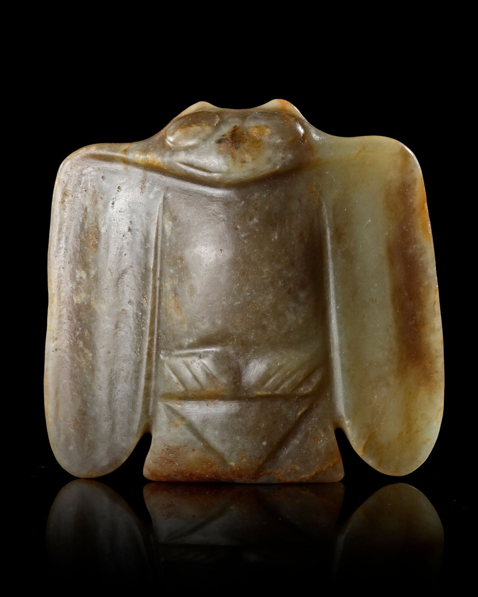 A CHINESE JADE OWL, HONGSHAN CULTURE (c. 4700â€“2900 BC): A rare green jade owl from the Hongshan culture, expertly carved in a stylized geometric form with prominent eyes and broad wings. The sculpture embodies the spiritual symbolism of the owl as a guardi