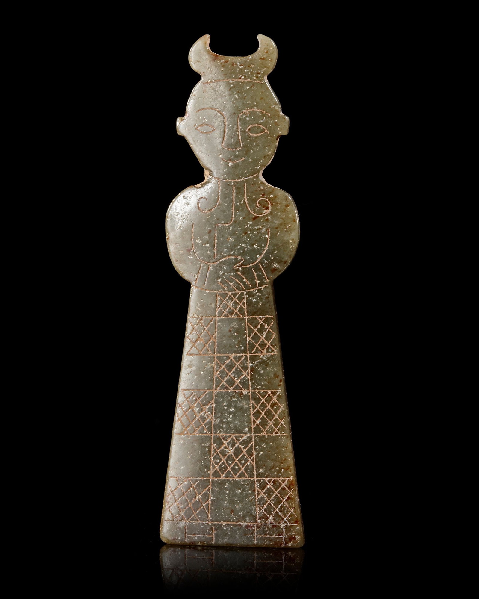 A HORNED JADE STANDING FIGURE, CHINA, WARRING STATES (475â€“221 BC): A finely carved green jade standing figure from the Warring States period, distinguished by its elegant horned headdress and elongated ceremonial robe. Delicately incised details and balanced proporti