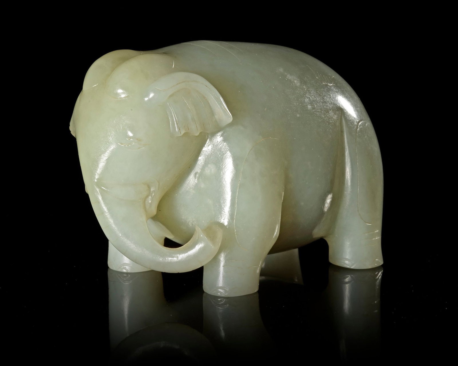 A GREYISH-WHITE JADE ELEPHANT, CHINA, HAN DYNASTY (206 BC-220 AD) (1 of 5)