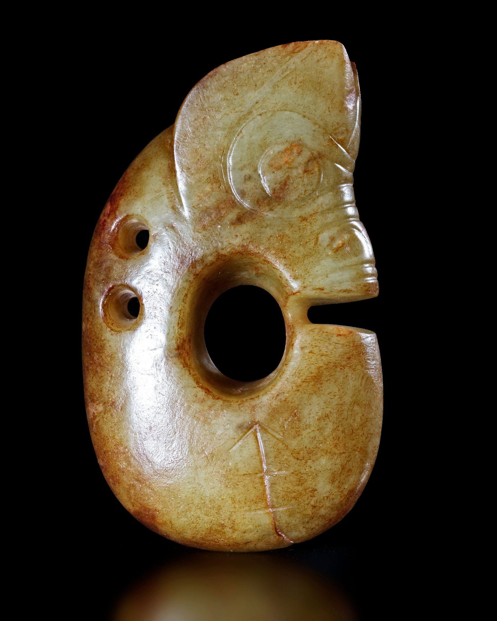 A YELLOW JADE PIG-DRAGON, 'ZHULONG', CHINA, HONGSHAN CULTURE (1 of 3)